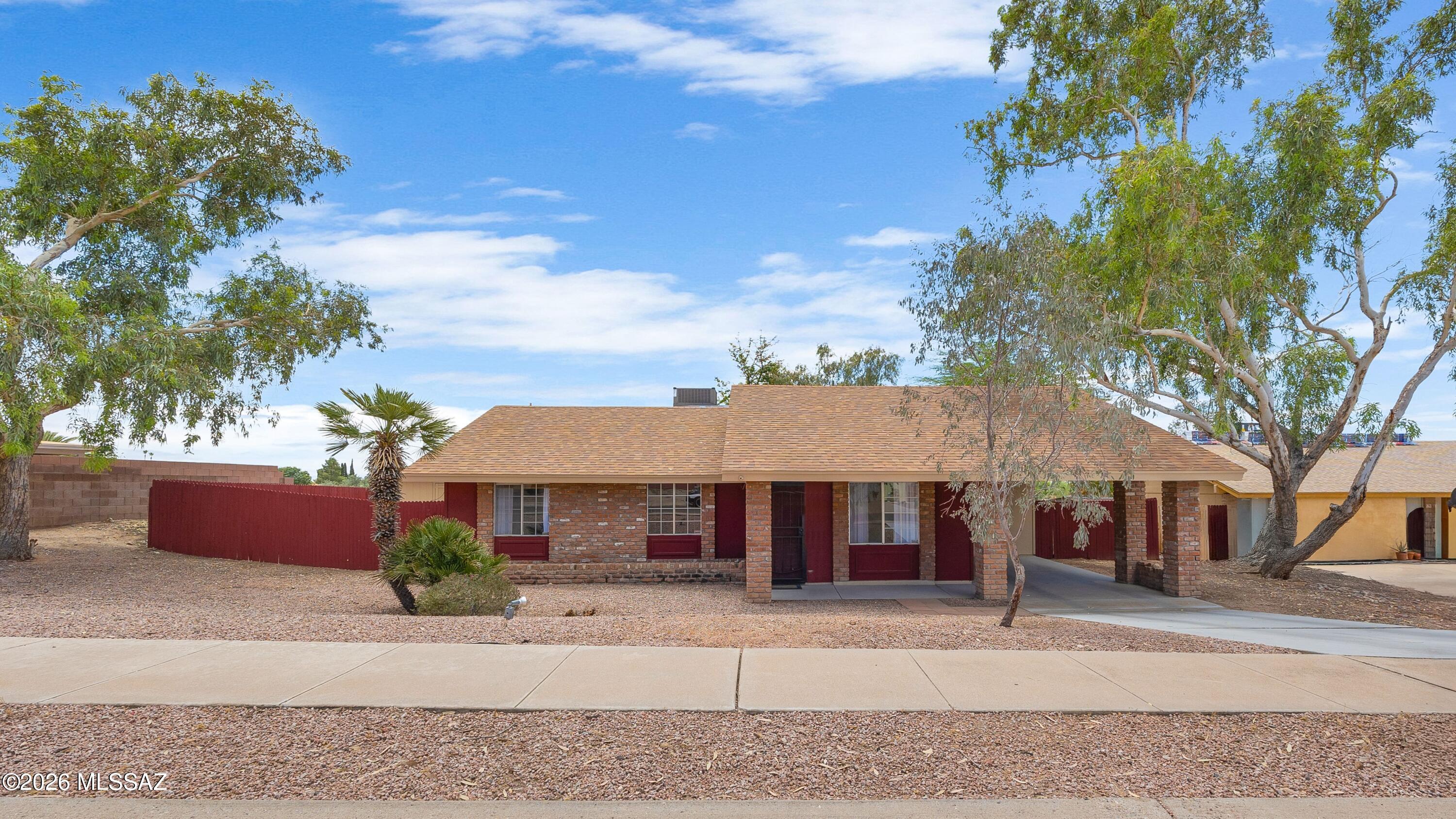 A HUGE PRICE REDUCTION!  SELLER SAYS BRING ALL OFFERS!  Super cute, remodeled home 5-minutes from Northwest Hospital & medical facilities & close to I-10!  NO HOA!  Completely remodeled kitchen with new cabinet doors & drawers & new granite countertops!  Also a remodeled bath area with a new tub cover & new toilet.  The home has been repainted inside & out, plus a new water heater & new dishwasher!  The roof is only one year old, & the refrigerator is only 6 years old.  The large convenient kitchen/dining area is perfect for preparing meals while visiting family & friends, & the enclosed heated & cooled Arizona Room is a perfect sitting spot, with a panoramic view of the large backyard!  The backyard is great for pets.  5-acre Wildwood Park is located 1/3 mile from the home....See More with tennis & basketball courts, a professional baseball diamond, a walking & jogging path surrounding the park, picnic areas, & a children's playground!  This home won't last long!