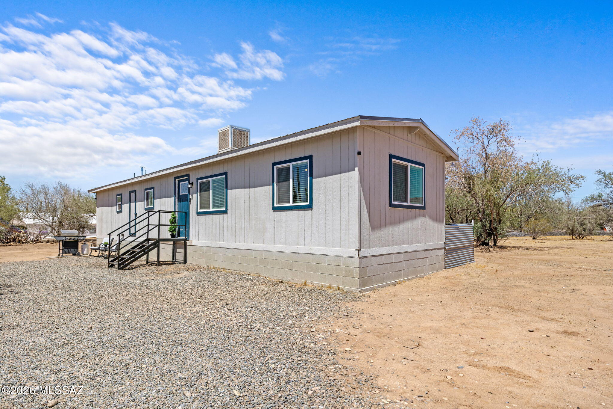 Seller shall entertain or counter offers between $200,000 and $225,000. Make sure you see this charming home featuring two bedrooms, a full bathroom, and an open floor plan. This Manufactured home is located in Marana on 1.01 Acres with natural desert landscape, no HOA & endless possibilities. The private gated driveway leads to the home, offering ample parking. Step inside this light-filled, move-in-ready manufactured home. As you enter the large living area you will see the vinyl plank flooring throughout, which flows into the open Kitchen. This fully functional Kitchen is complete with plenty of newer cabinets, granite countertops and an island/peninsula with seating for dining and extra storage. The owner's suite features plenty of natural light and a large closet. With a split floor plan, there is also an additional guest bedroom and a guest bath, featuring a shower/tub combo in the hallway for your convenience. The guest bedroom has a door for bathroom access and could become the primary suite.Enjoy this home, which offers true privacy in the heart of Marana. Enjoy calming mountain views with panoramic sunrises & sunsets from your completely fenced backyard. It is located just 20 minutes from the I-10 and offers unlimited outdoor space with established trees. Bring all your toys, such as RV, ATV, and boat there is plenty of space! And remember no HOA restrictions. The home comes with a metal roof and a new AC system installed in August 2025. There is a fully functional evaporative cooler also, if that is what you prefer. Also you will love the energy efficiency of the new windows throughout.
What are you waiting for? Make the call today!