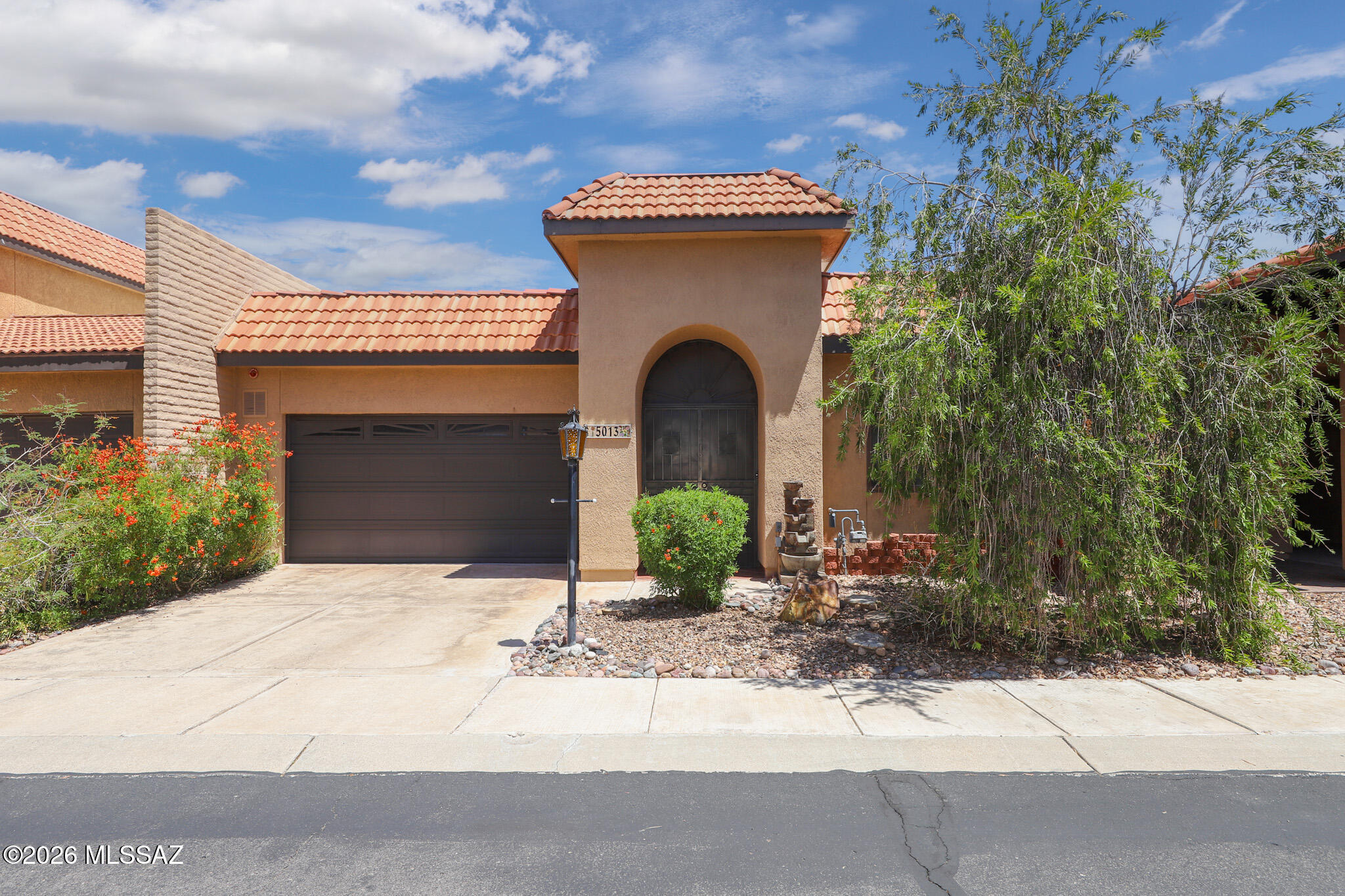 Rare opportunity in a desirable central Tucson townhome community, this thoughtfully updated residence combines comfort, character, and convenience. Ideally located near shopping, restaurants, entertainment, and the University of Arizona, you'll enjoy easy access to everything Tucson has to offer while still benefiting from a peaceful neighborhood setting.
Inside, unique atrium spaces fill the home with natural light and create inviting areas perfect for a garden retreat, home office, reading corner, or creative flex space. The beautifully remodeled kitchen and updated bathrooms provide modern style and functionality, while newer windows, a newer HVAC system, and a newer water heater add value and peace of mind. Tile flooring throughout enhances the bright, open feel of the home. The well-designed split-bedroom floor plan offers privacy for both residents and guests, with the secondary bedroom and bath providing a comfortable suite-like arrangement. Sliding glass doors from both the living area and primary suite lead to a private backyard oasis featuring a covered patio and mature citrus trees. Completing the package is a highly sought-after two-car garage, offering ample parking and additional storage space.