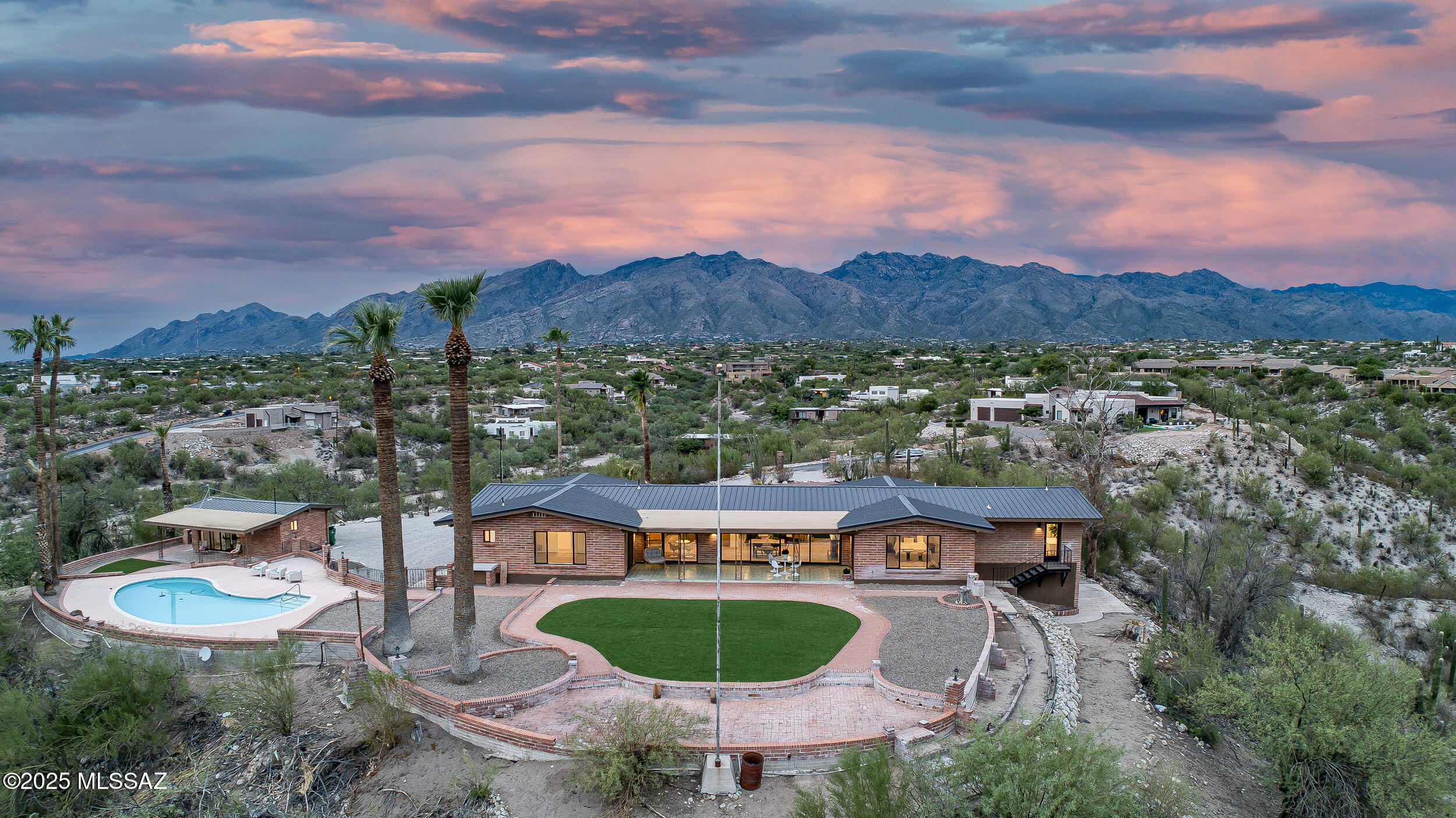Luxury Live Auction! Bidding to start from $1,100,000.00!

Exquisite 3.5-acre estate in the heart of Tucson featuring a fully remodeled 2,801sqft main home with 2 car garage, 743sq guest house, and 375sq pool house. Modern upgrades include new metal roof, new AC units and mini splits, all new appliances, and fully remodeled with refined finishes throughout. The main home offers 3 ensuite bedrooms + powder room, a gourmet kitchen, great room with sweeping city views, and formal living with fireplace looking out at mountains you feel you can touch! Walls of glass concept open to an extended covered patio overlooking the pool, desert, turf yard, and Tucson skyline. Pool house opens to the shared backyard retreat for in-laws or adult kids. Guest house enjoys its own driveway, laundry, and patio. A rare blend of privacy, views, and luxury. New septic!