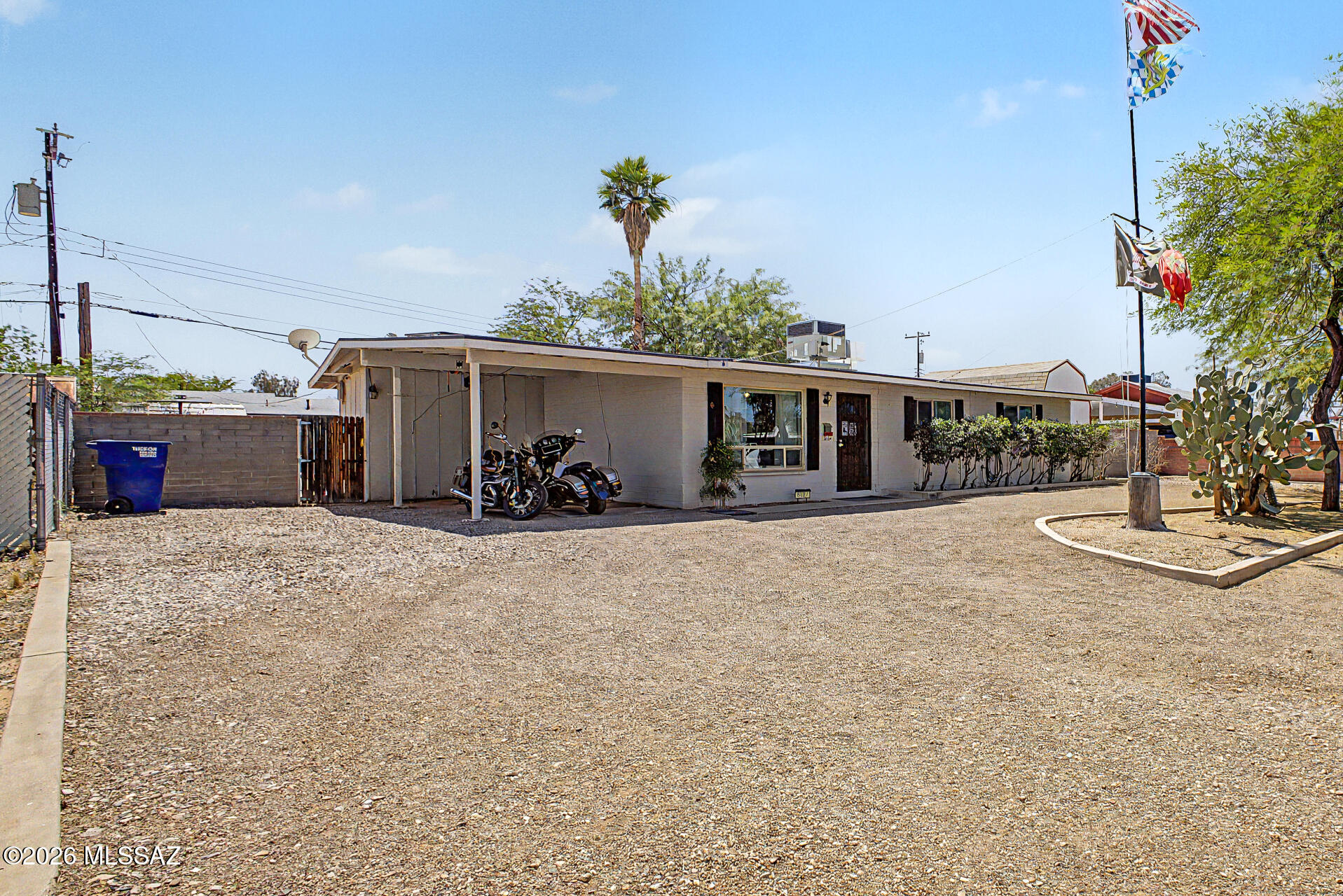 Look NO further! This charming 3-bedroom home is now on the market, featuring carport parking, a circular driveway, and a mature desert landscape. Enter to discover a welcoming living room with pre-wired surround sound, ideal for movie nights or relaxing with loved ones. Vaulted ceilings, tile flooring, ceiling fans, and custom paint add character and comfort throughout. The eat-in kitchen offers track lighting, matching appliances, ample cabinetry with crown moulding, and granite tile counters. The primary bedroom is a peaceful retreat with a private bathroom that includes a shower & tub combo. Enjoy the spacious backyard, complete with a covered patio and two storage sheds, perfect for weekend gatherings or quiet evenings. Solar system keeps utility bills low! No HOA!