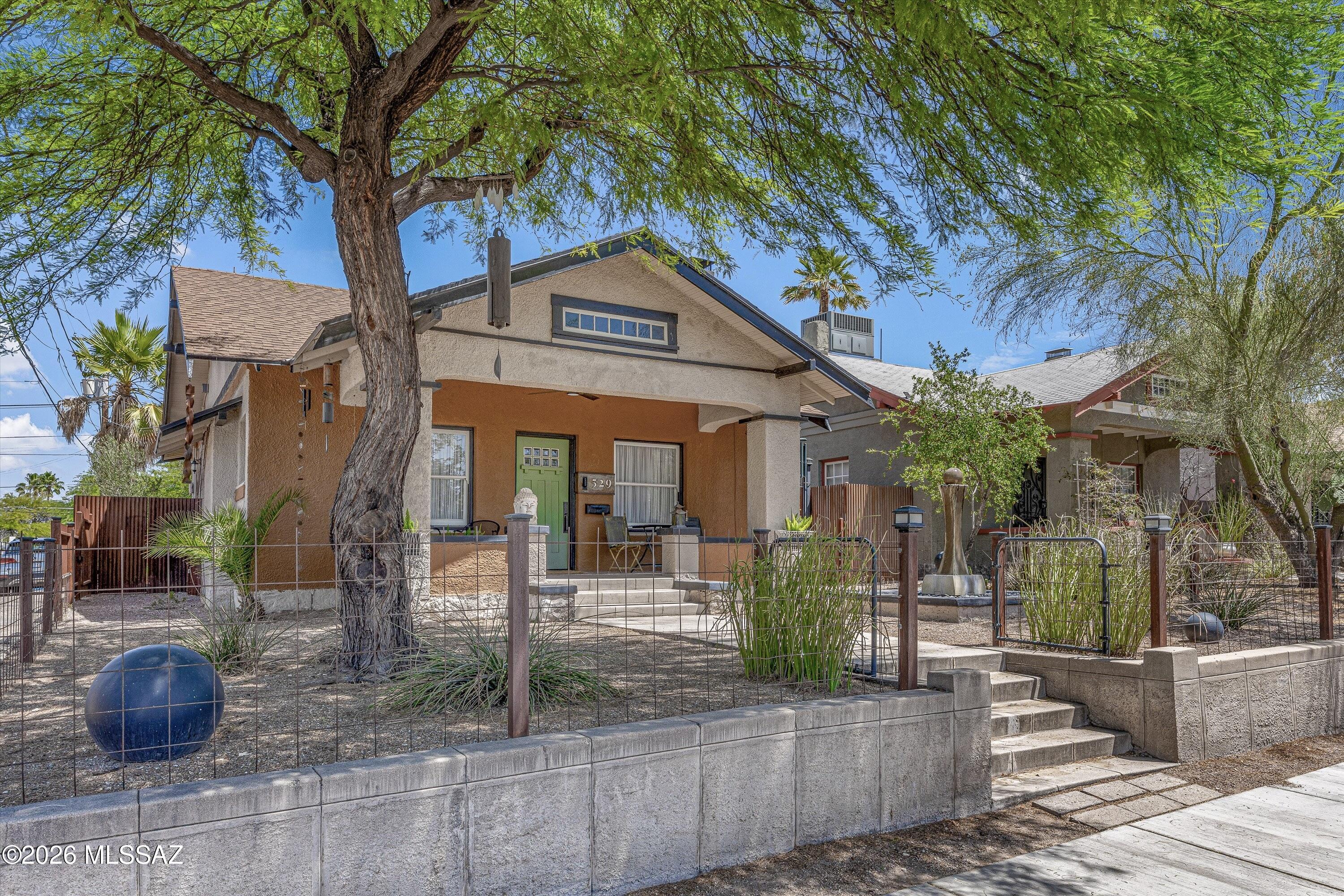 Built in 1915 extensively remodeled 2BR+den, 2BA home beautifully blends timeless character with modern functionality. The home has been thoughtfully updated to meet today's lifestyle while preserving the warmth and personality of the historic home.The beautifully redesigned kitchen features a functional layout, multiple pantry spaces, and smart storage solutions that make everyday living effortless. Updated finishes throughout complement the home's historic appeal, perfect balance of old-world charm and contemporary comfort.Spacious living areas, restful bedrooms (3rd bedroom currently being used as an office), remodeled bathrooms, and carefully selected upgrades provide peace of mind while maintaining the home's character. Desirable UofA location, close to downtown, dining, shopping.