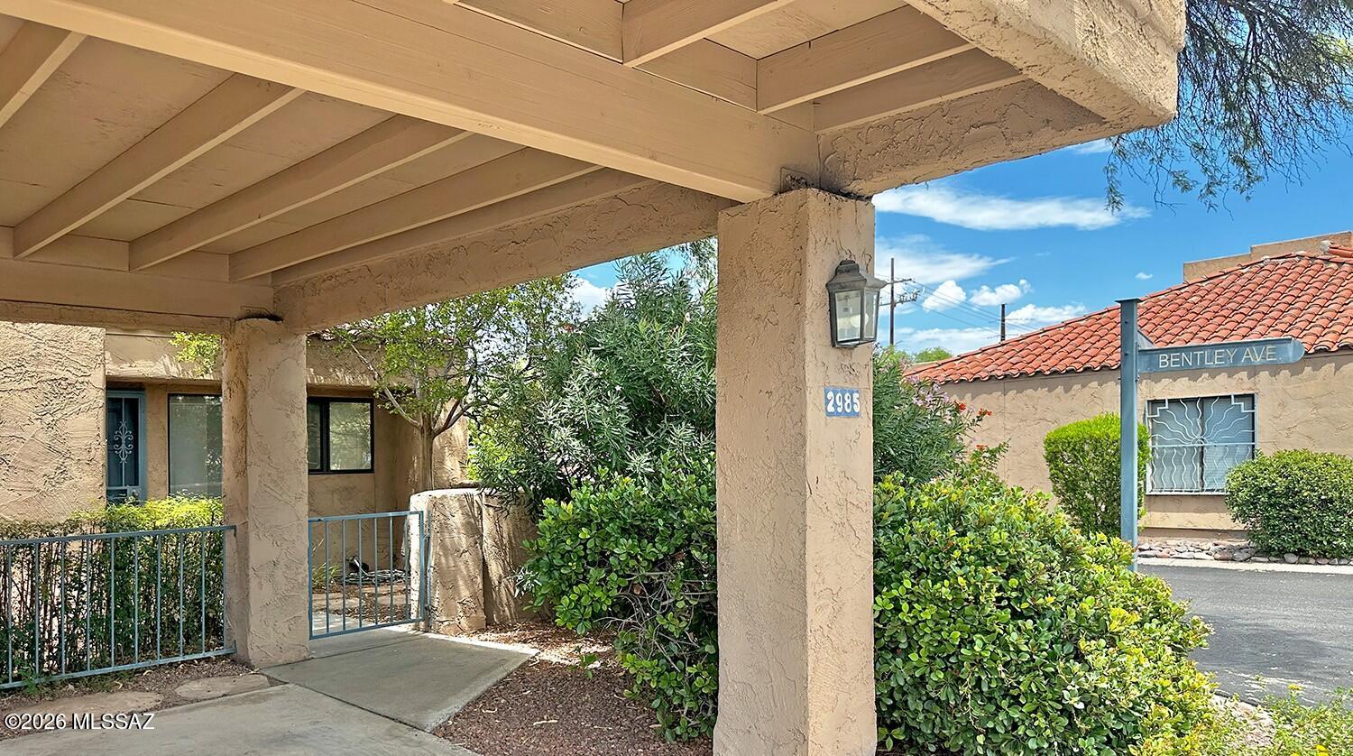 Crepe Myrtle ''tree'' in front courtyard. Rear yard with two patios, one off Primary Suite and one at Great room, both with sliding door access to private rear yard (in direction of Catalinas).  End unit with east facing dining area window - for your morning coffee?  Large stainless kitchen, with nicer appliances including a convection/air-fry range, Bosch quiet-type dishwasher, big fridge with filtered ice/water in the door.  Smartly located a short walk to community pool/spa/BBQ's/clubhouse and mailbox CBU.  2-owners since new.  Recently refreshed 2022-2024 (light finishes, wood-look plank flooring, blinds/shades, appliances)
Beamed volume ceilings in Great Room/Kitchen, 
Ceiling fans and big closets in both spacious bedrooms. Lockable storage room off carport with private EV recept