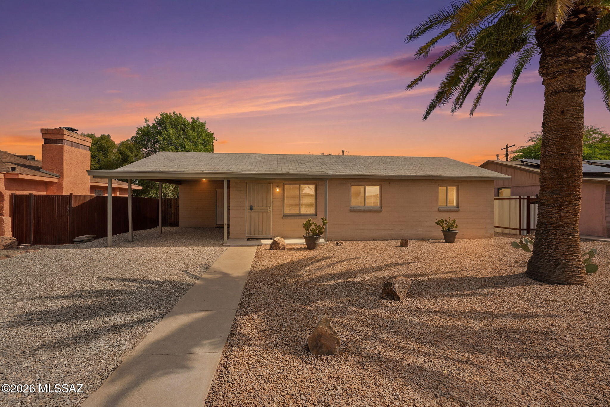 Amazing opportunity for affordable turnkey 3 bedroom/1 bath, single story 1951 masonry stucco Mid-Century Modern ranch home on .14 acre R-2 lot, the freedom of no HOA, covered carport, on and off street parking, in thriving Central Tucson. Priced below the $300,290 RVM property value, the perfect solution for those looking for an Airbnb investment property, long term rental, seasonal visitors (no stairs/no steps), secure student housing, first time home buyers, or anyone searching for a low maintenance home. Excellent Central Tucson location, boasting a 94 Biker's Paradise score, minutes away from the University of Arizona and Banner Medical! N/S orientation providing daily Catalina Mountain views, shingle roof, covered front patio, solid metal security doors, completely landscaped low maintenance front yard with fresh crushed decorative rock and granite boulders. Inside buyers will appreciate energy efficient double pane windows throughout, matching custom white wood blinds, freshly painted 2026, textured painted ceilings (no popcorn throughout), tile flooring (no carpet throughout), Rheem gas HVAC, Rheem gas water heater, updated full bathroom with tiled glass door walk-in shower with bench seating, rain shower head and exhaust fan, dedicated laundry room with washer and dryer included plus additional storage, 3 panel internal wood doors, ceiling fans with overhead illumination in bedrooms, spacious living room, dining area adjacent to cozy kitchen with gas stove, exhaust fan, white appliance package including 2025 LG refrigerator, dishwasher, brand new kitchen faucet, double sink with garbage disposal under garden window providing fantastic natural light.
Enjoy tranquil Tucson nights from under your covered extended back patio, appreciate the manicured landscaped backyard with always green artificial grass, raised flower garden, custom firepit, Belgard pavers, convenient side gate out for walks, recent crushed decorative rock, updated 200 AMP electrical, surrounded by privacy fencing.
Desirable Central Tucson location, enjoy fine dining at Culinary Drop Out, Postino, Snooze, Kingfisher, Blue Willow restaurants, walk to LA Madera Park, Conner Park and Tahoe Park, located just .5 miles from shopping/groceries/restaurants on Campbell Ave, minutes away from Banner Medial and the University of Arizona. Call to make your appointment to view this move in ready home today while it is still available!!