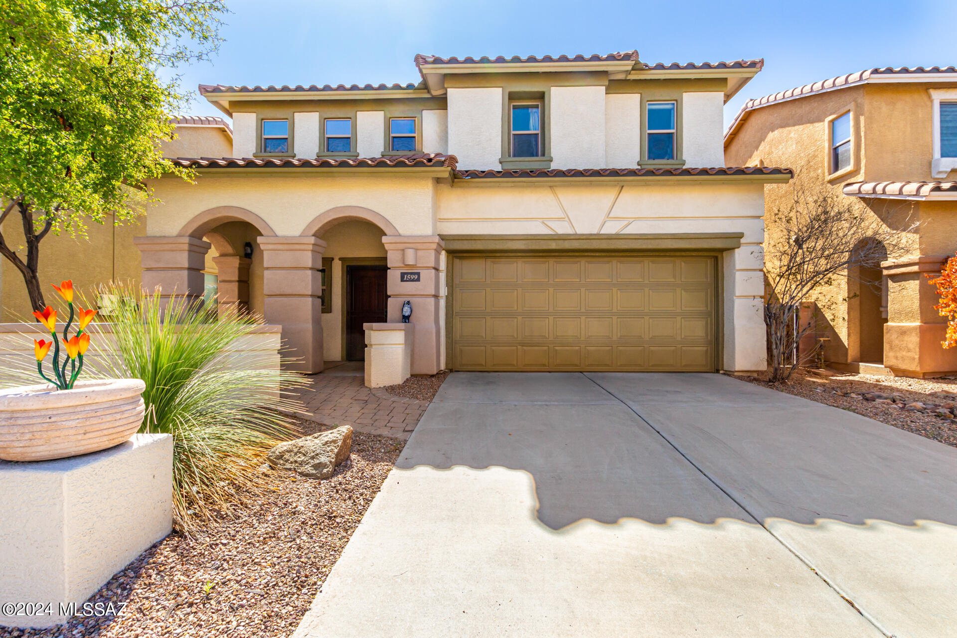 Look no further - fantastic opportunity to live in this well maintained, move - in ready, spacious home in excellent Tucson's NorthWest location! Like to cook and entertain? The kitchen with corean counter tops, great storage and spacious pantry is set right next to the entrance to the covered back patio with gas grill and no neighbors behind you! Eighteen inch tile, diagonally laid out, throughout downstairs. Three charming, good size carpeted bedrooms, two baths, laundry and loft with built-in desk are upstairs. Mountain views from upstairs bedrooms and loft. Well established subdivision, close to a freeway, downtown and the UofA. Come and see for yourself - this one will not disappoint! Call for an easy showing!