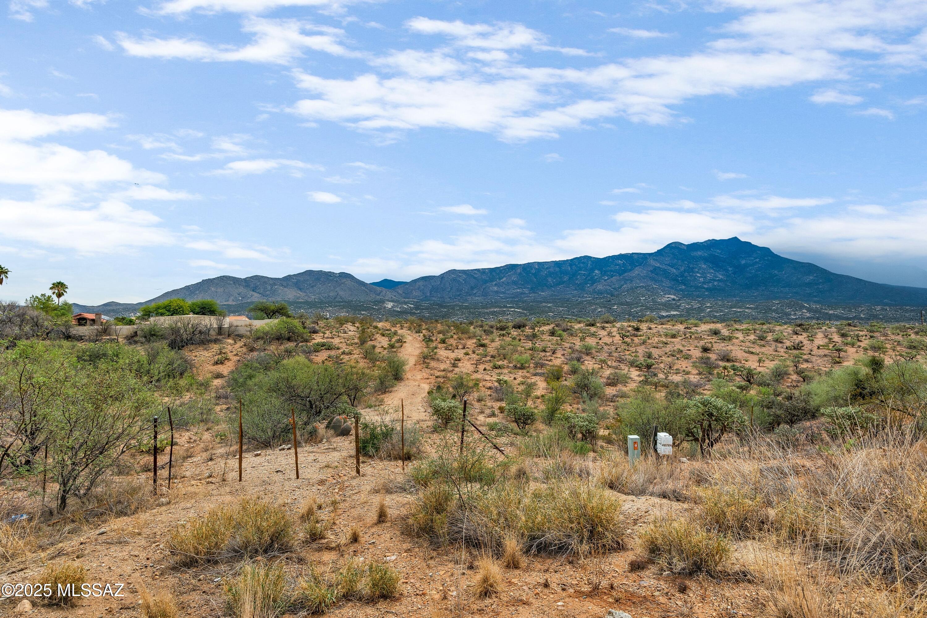 Bordering state land and community open space, this property offers a rare opportunity to build your dream home with panoramic mountain views. Located just outside the highly sought-after SaddleBrooke Community and near the world-renowned Miraval Resort, the site combines privacy, natural beauty, and convenience. With no HOA restrictions, the possibilities are wide open. In addition, the property presents potential for office or commercial rezoning (buyer to conduct due diligence and verify rezoning feasibility). An outstanding investment in a prime location, perfect for custom residential living or future development. Utilities at the lot line and manufactured homes are permitted.