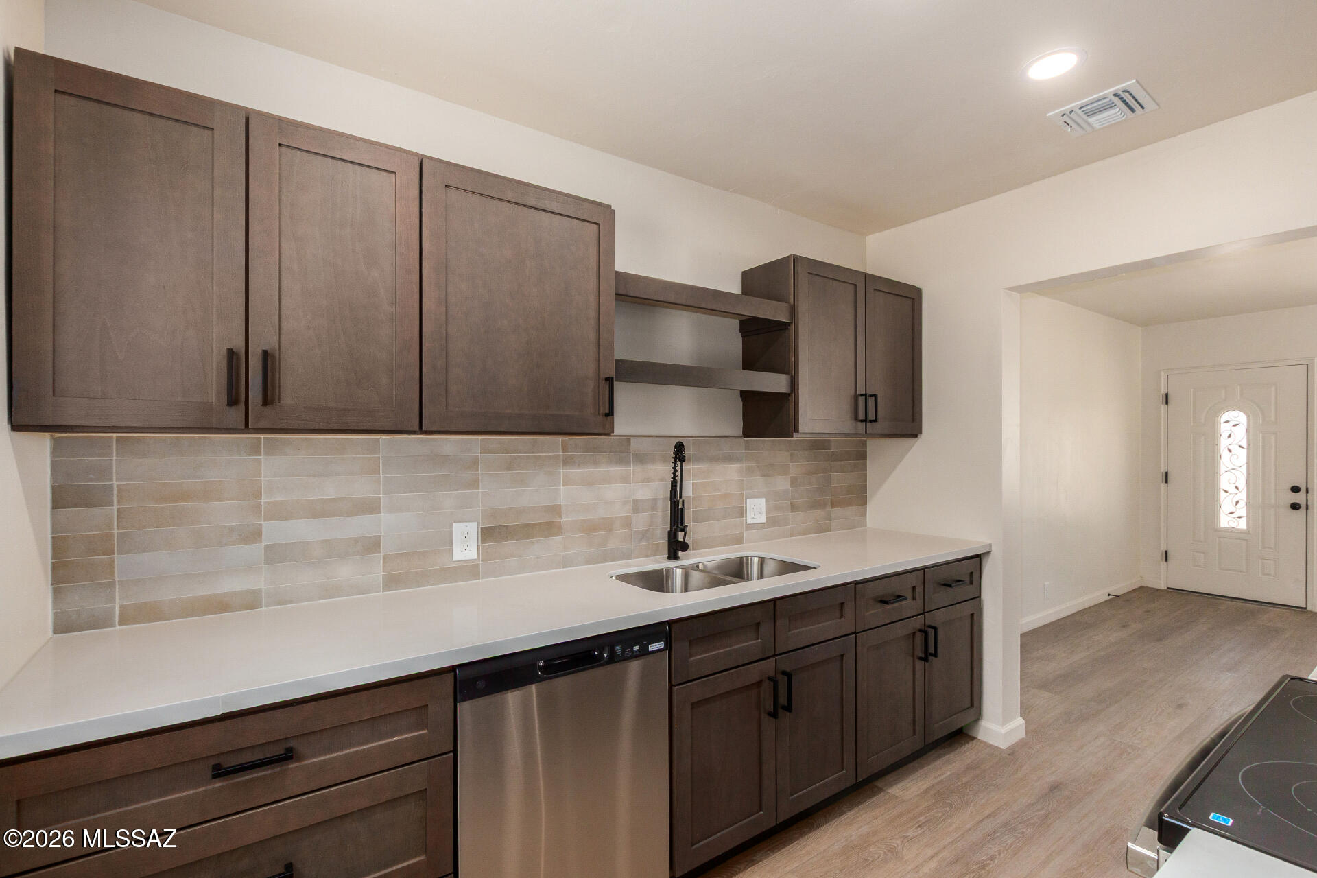 Now available!  Updated home in Coronado Heights neighborhood. Beautiful features include luxury plank flooring, fresh interior paint, stainless steel appliances, Quartz countertops, neutral brown cabinets, earth tone backsplash and plush carpet in bedrooms. Fresh exterior paint. Large backyard with lots of possibilities.  A must see!