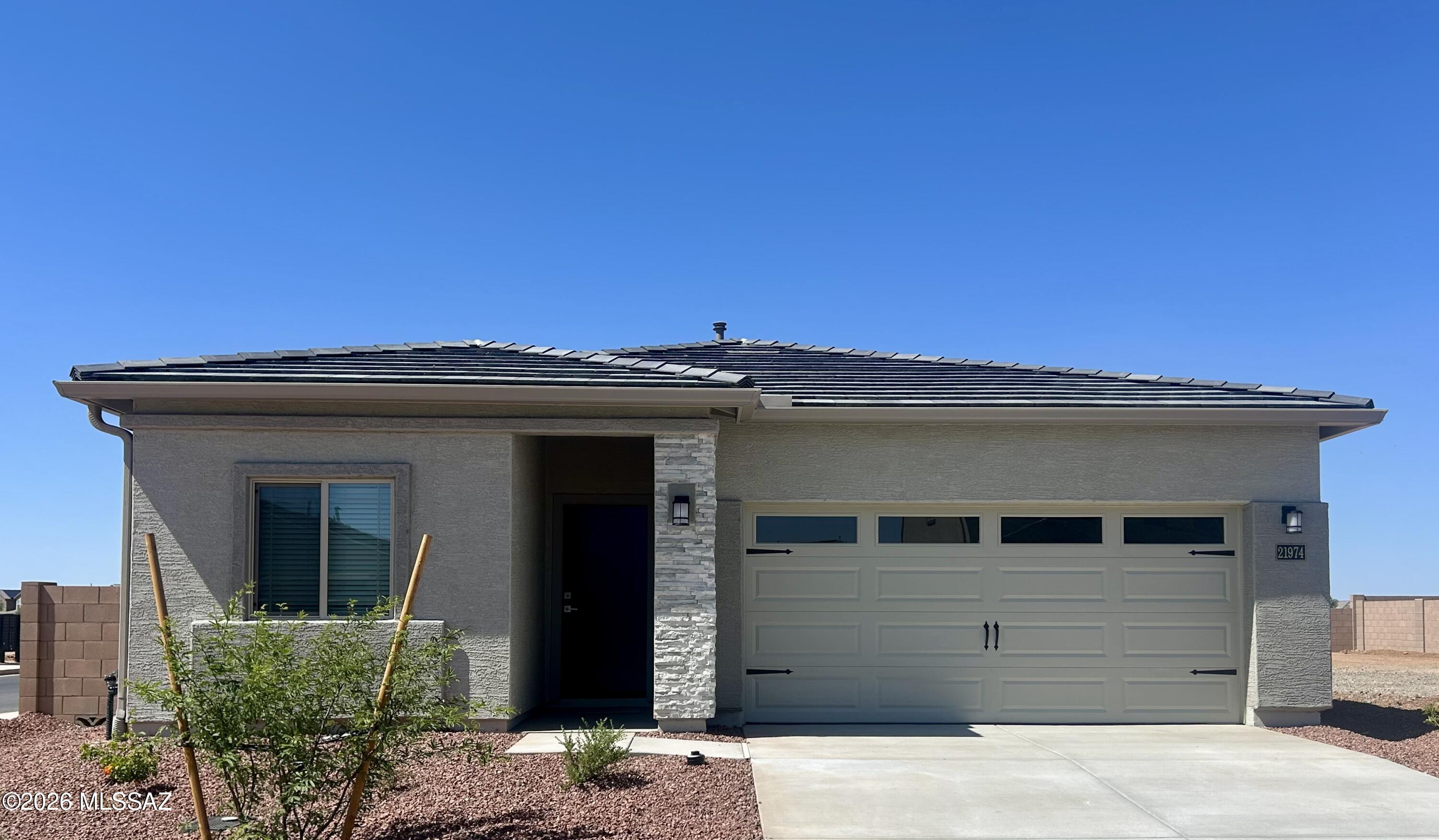 The Amado plan by LGI Homes is a must-see! This home is meticulously crafted with a focus on both style and functionality. This three-bedroom, two-bathroom home showcases a thoughtfully designed layout that exudes comfort. The family room seamlessly connects to a beautifully upgraded kitchen, creating an inviting space for daily living and entertaining. Nestled in a tranquil corner, the master suite offers a haven of serenity and seclusion. Two more bedrooms provide ample space for your family or guests to relax in their own comfort. Better yet, this home is located in the amenity-packed community of Red Rock Village. You will love calling this area home!