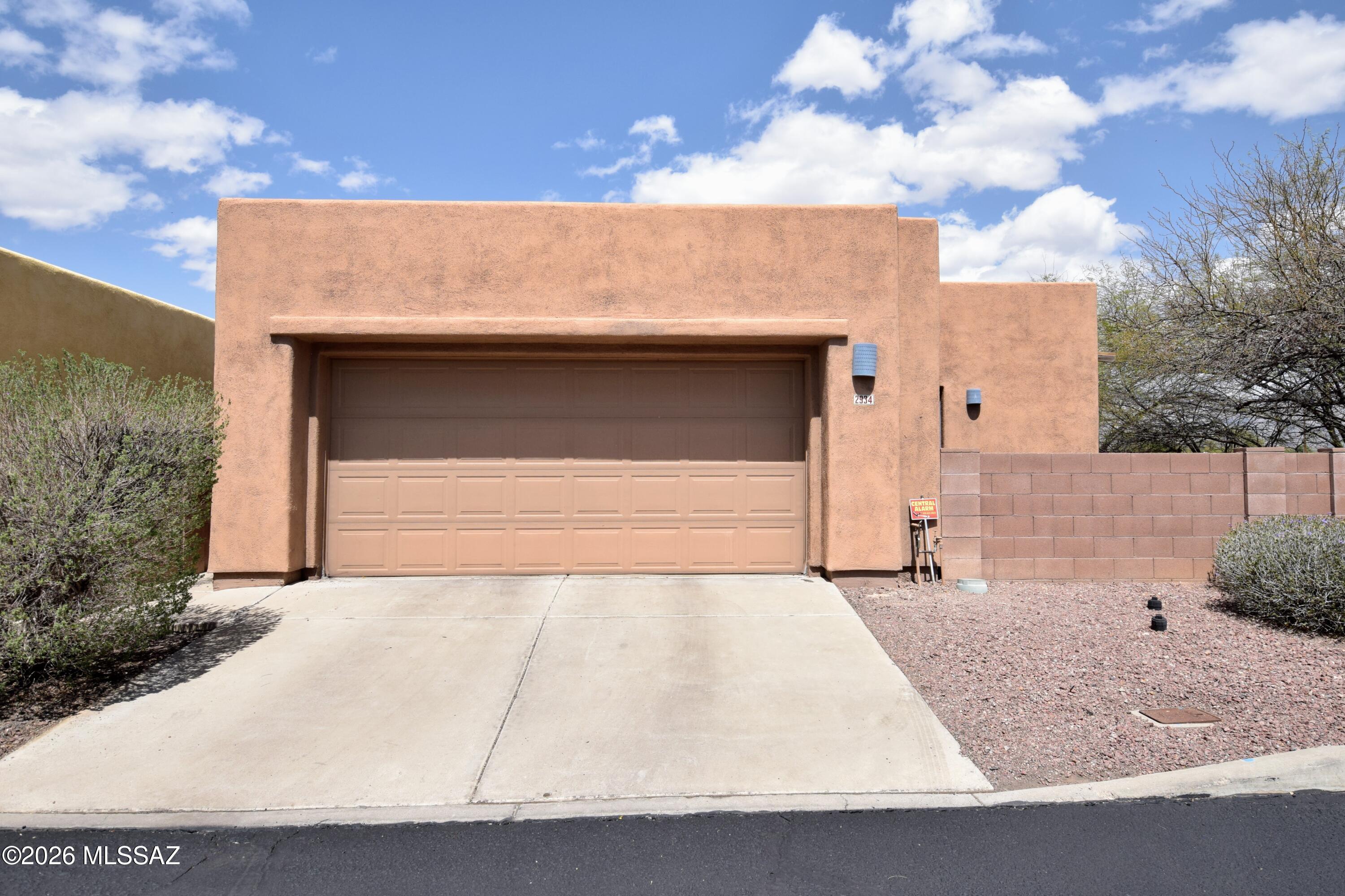 Located in the highly desirable Midtown Monte Vista community of Tucson, this beautifully designed Southwest Contemporary home built by TJ Bednar offers a perfect blend of style, comfort, and ultimate convenience. The bright, 1,345-square-foot interior boasts a single-level layout refreshed with durable tile flooring and abundant natural light throughout, highlighted with clerestory windows in the primary suite. An open kitchen features a breakfast bar, functional pantry, and plenty of counter space, making it perfect for cooking and casual entertaining. The spacious primary suite is complete with a walk-in closet and an oversized dual-sink vanity. For outdoor enjoyment, a walled-in yard wraps around three sides of the home and features three separate sets of access doors, providing a private and versatile outdoor living space. Residents will appreciate practical upgrades including secure parking in a two-car garage, convenient in-home laundry with an included washer and dryer, and quick access to local midtown shopping, dining, medical centers, and public transit corridors. This property maintains a strict non-smoking policy, and pets are considered subject to owner approval. Combining timeless desert architecture with modern rental amenities, this move-in-ready home is perfectly positioned to enjoy the very best of central Tucson living.