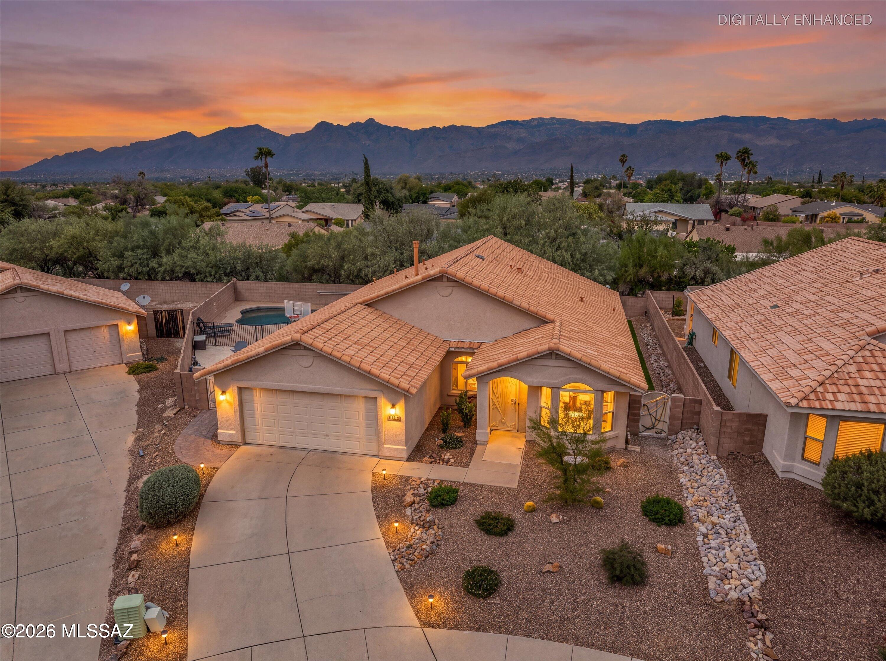 Welcome to this spacious 4 bedroom, 2 bath home with a private pool and spa! The open, bright floor plan offers generous living and dining spaces with tile or laminate flooring throughout. The kitchen features granite countertops, stainless steel appliances, gas range, center island, pantry and abundant storage. Both the primary and guest bathrooms have been beautifully updated with granite countertops, tile surrounds and newer tile flooring. The spacious primary suite also features dual sinks, extra large walk in shower and oversized walk-in closet. Outside, enjoy a covered patio and fenced pool/spa area, perfect for relaxing or entertaining. Green space behind homes offer nice privacy. A wonderful Tucson home with plenty of space inside and out!