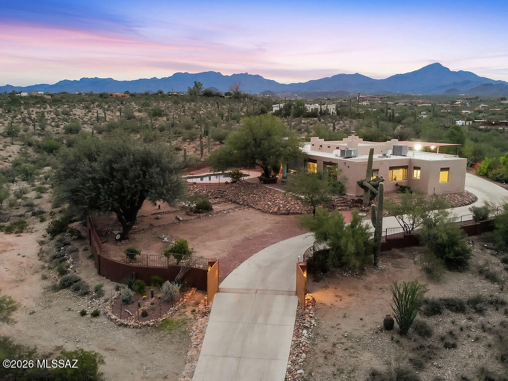 RANGE PRICE 805,000-825,000...WESTSIDE GEM ON TOP OF THE HILL!! PRIVATE ENCLOSED GATED PROPERTY WITH 360 DEGREES OF MOUNTAINS VIEWS!!  CUSTOM HOME BUILT IN 2001 ORIGINAL OWNERS. OFFERS 3 BEDROOMS 3 BATH. WITH AN  ADDITION THAT HAS A DOOR THAT CONNECTS TO THE MB FOR AN OFFICE,STUDIO, PARENTS RETREAT WITH OWN BATH. SITTING ROOM OR DEN TO ENJOY THE SUNRISE.THIS HOME IS PERFECT FOR ENTERTAINING WITH COVER PATIO ENCIRCLING THE HOUSE THAT LEADS TO A ENCLOSED SPARKLING POOL. A METAL CARPORT 40X30 WAS JUST BUILT IN 11/2024 FOR YOUR RV, BOAT OR TOYS.THERE'S ROOM TO BUILT A GUEST HOUSE OR CORRALS ON THE EASTSIDE OF THE PROPERTY. UPGRADES INCLUDE GRANITE IN KIT & 2 BATH & NEW TILE FLOORS DONE IN 2024. PEBBLE POOL DONE 1/2026,ROOF RECOATED 4/2026, PERMITTED ADDITION WAS DONE IN 2007. A MUST SEE!!!