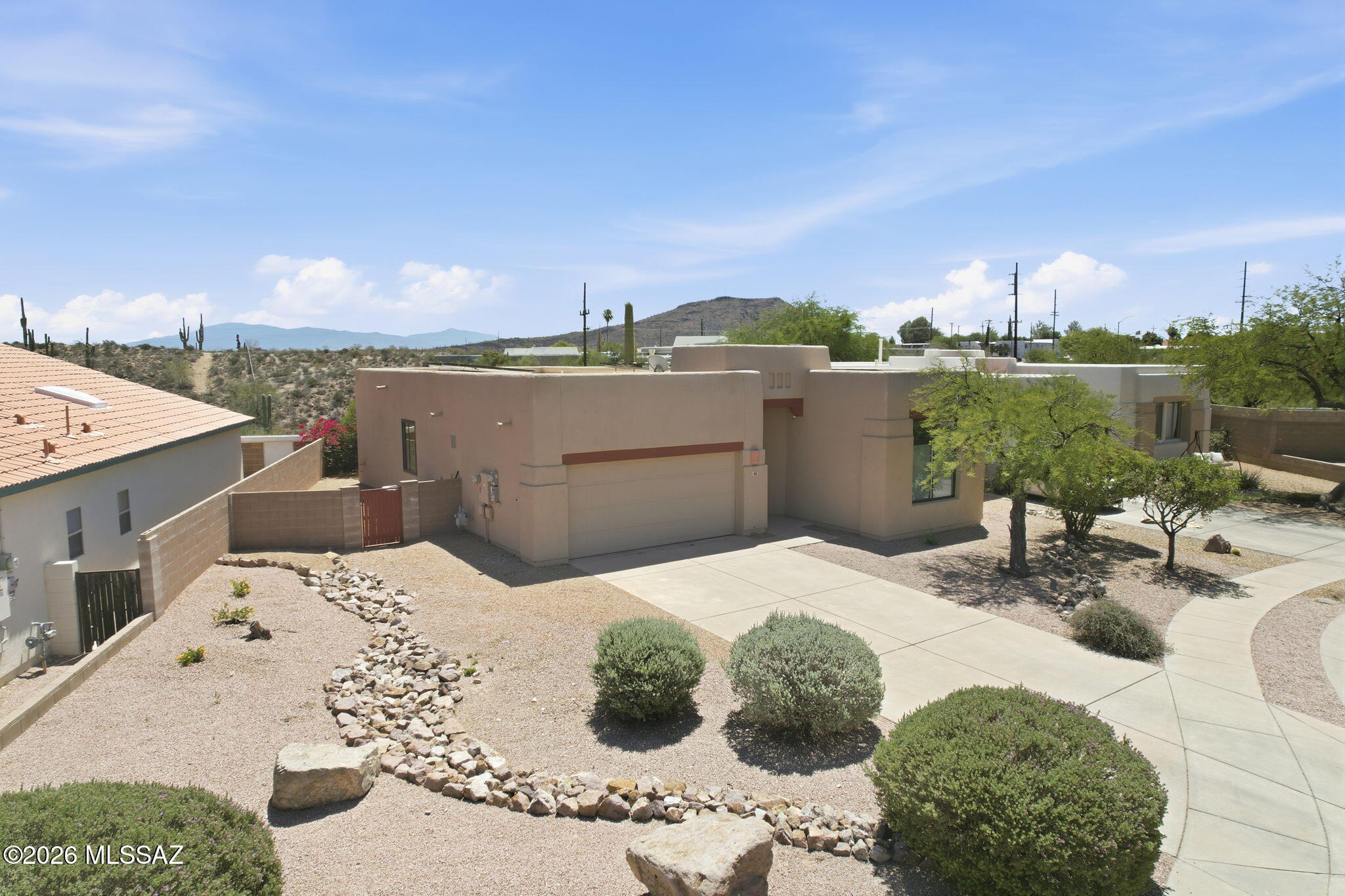 Ultra clean and move-in ready! Beautifully updated 2BD/2BA home with 3rd room that could be used as a 3rd bedroom, den, office, studio or library in the gated Desert Montage community on Tucson's desirable west side. Conveniently located minutes from Downtown Tucson, the University of Arizona, Banner Medical Center, shopping, dining, and entertainment. Bright open floor plan with soaring ceilings throughout, spacious bedrooms, full marble bathrooms, and modern upgrades. Enjoy low-maintenance living, no rear neighbors, gated privacy, fully paid solar with battery backup, and an EV charging station. Energy-efficient and truly turn-key--ideal for a primary residence, seasonal retreat, or investment property.