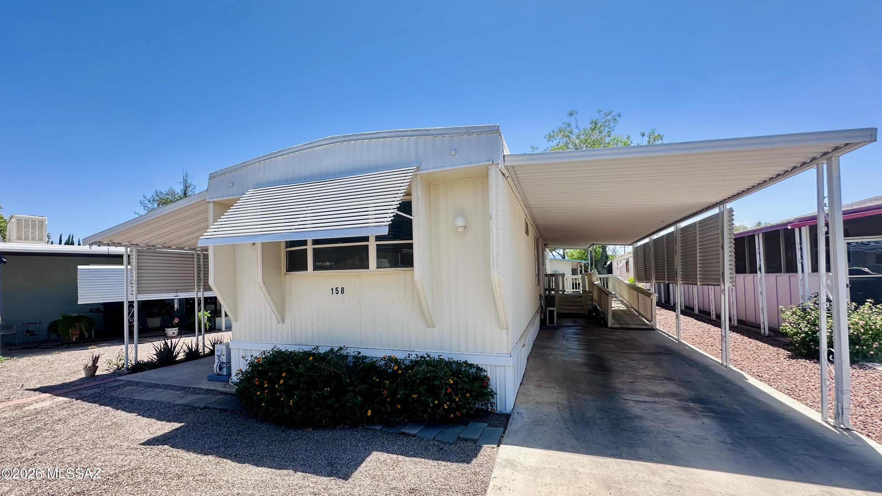Enjoy the Arizona lifestyle in this well-maintained 2-bedroom, 2-bath co-op home offering 980 sq. ft. of comfortable living space. The open layout, updated flooring, bright kitchen, and spacious living area create a warm and inviting atmosphere. The covered carport and accessibility ramp add convenience, while the low-maintenance landscaping means more time to relax and enjoy the community. Whether you're looking for a year-round residence or a winter retreat, this move-in-ready home is an excellent opportunity for affordable living in sunny Tucson.
Don't miss your chance to own a comfortable, updated home at an affordable price!