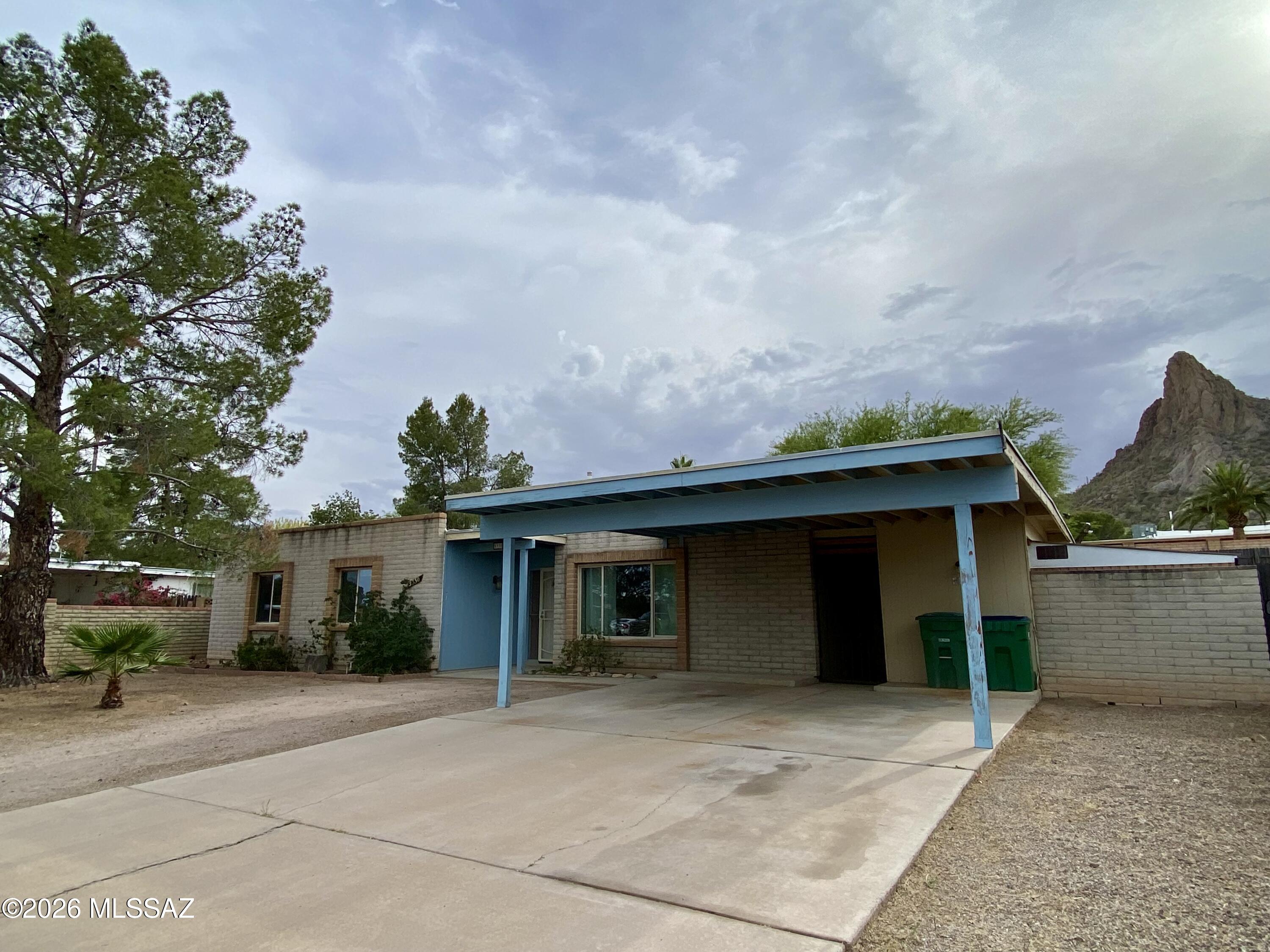 Discover the opportunity waiting at this 4 bed, 2 bath ranch-style home. It offers solid livability today with tremendous upside for tomorrow. Priced to leave room for your personal improvements, this is the kind of property savvy buyers watch for. Enjoy stunning mountain views, a spacious backyard, mature landscaping, and a long back porch perfect for relaxing mornings or evening sunsets. Dual pane windows add value and efficiency, while the carport provides convenient covered parking. Plenty of storage and workshop space add even more versatility for hobbies, projects, or extra gear. Whether you're looking to create your dream home, invest wisely, or uncover a true diamond in the rough, this property delivers location, space, and potential at an attractive price. Opportunity is knocking.
