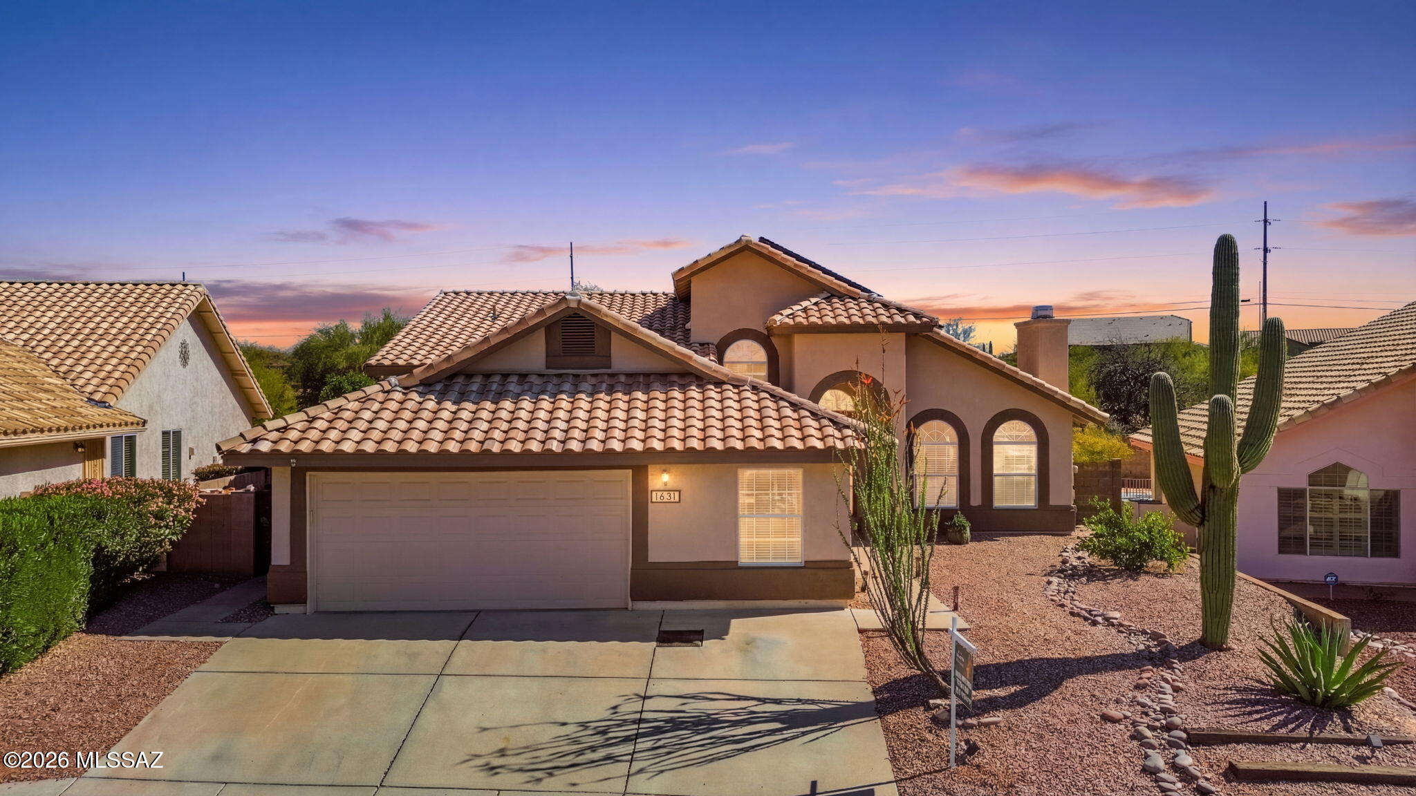 Seller will accept and or counter offers from $577,997 - $597,997. Spacious tri-level NW home w/ 5 bedrooms, 3 bathrooms, tile flooring throughout & fully owned solar. A flex room off the garage is ideal for a gym, playroom, or office, & could easily be converted to a 3 Car garage. The lower level features a large en-suite currently used as a game room, an additional bedroom & the laundry room. The main level offers the kitchen, living & dining areas w/ access to the backyard w/ pavers, citrus trees, a pool & spa--perfect for entertaining.Upstairs you'll find the primary suite w/ automatic rolling shutters & a private balcony overlooking the pool, plus two additional bedrooms & a guest bathroom. The fully owned solar provides excellent energy efficiency, w/summer electric bills under $26.