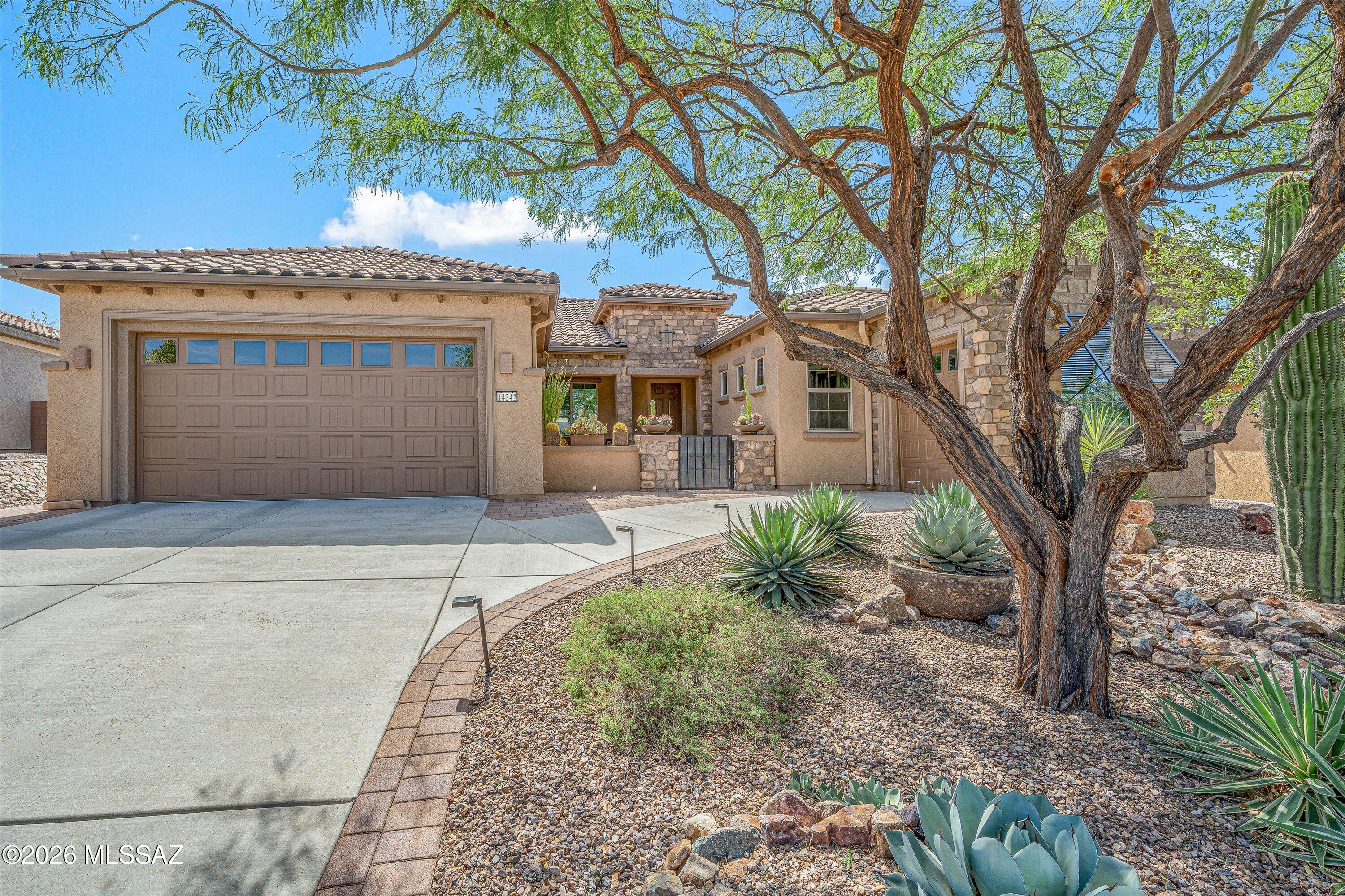 Exceptional value among the larger floor plans in Del Webb at Dove Mountain, this beautifully upgraded 2,474-square-foot Endeavor offers 2 bedrooms, a den/office, 2.5 baths, and a spacious 10,149-square-foot lot with multiple indoor and outdoor living areas.

Natural morning light fills the open-concept living spaces, while the kitchen features rich cabinetry, quartz countertops, a gas cooktop, new refrigerator and dishwasher, and updated pendant lighting over the island. A rarely offered built-in wet bar adds extra functionality for entertaining and connects naturally with the dining and living areas.

The spacious primary suite includes a walk-in shower with separate rain head and handheld shower, along with a custom-designed walk-in closet offering excellent storage. Outside, mature desert landscaping surrounds paver patios that extend from the inviting front courtyard to the backyard. An extended ceramic-tile covered patio provides additional space for relaxing, dining, and entertaining outdoors.

Storage and flexibility are standout features. The two-car garage includes a desirable two-foot extension, while the separate golf-cart garage includes power, a window, and cabinetry, making it ideal for use as a workshop, hobby area, or additional storage.

Residents of Del Webb at Dove Mountain enjoy an active 55+ lifestyle with access to the clubhouse, swimming pool, fitness amenities, pickleball, tennis, bocce ball, walking paths, and the natural beauty of Dove Mountain.