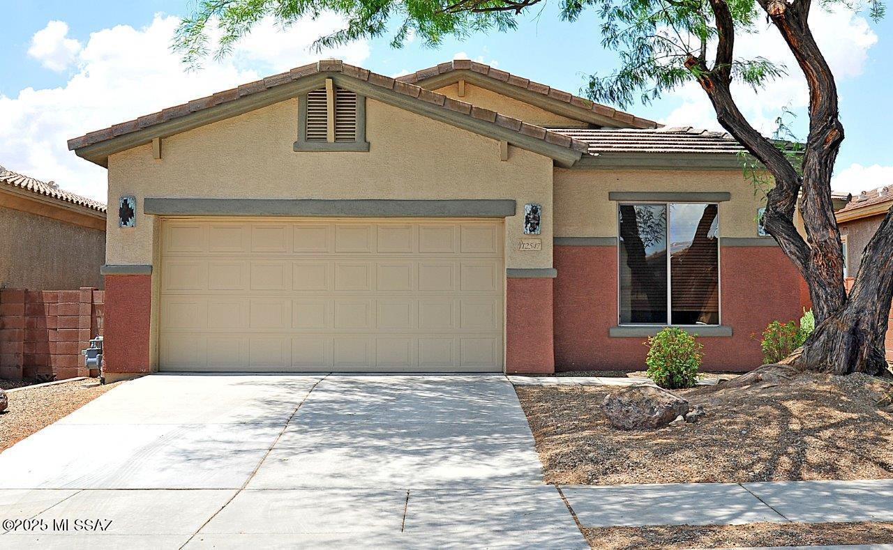 Gated neighborhood with 4 bedroom+ den, 2 bath 2165 SQ.FT. great rm plan with premium lot in Dove Mountain. All appliances included! Tile flooring in all the traffic areas including great room with carpet only in bedrooms. Open spacious kitchen with large island/breakfast bar, pantry, & lots of cabinets for tons of storage. Primary bedroom suite has door to patio, dual sink, separate shower & garden tub. Den/office space off the great room. Laundry room with utility sink, washer & dryer included. Covered patio & easy-care landscaped backyard with view fencing to enjoy the desert behind & sunset views. Non-smoking home. 1 year minimum lease. $45 application fee per adult. Renters insurance required. Call listing agent for pet policy & additional costs for pets.