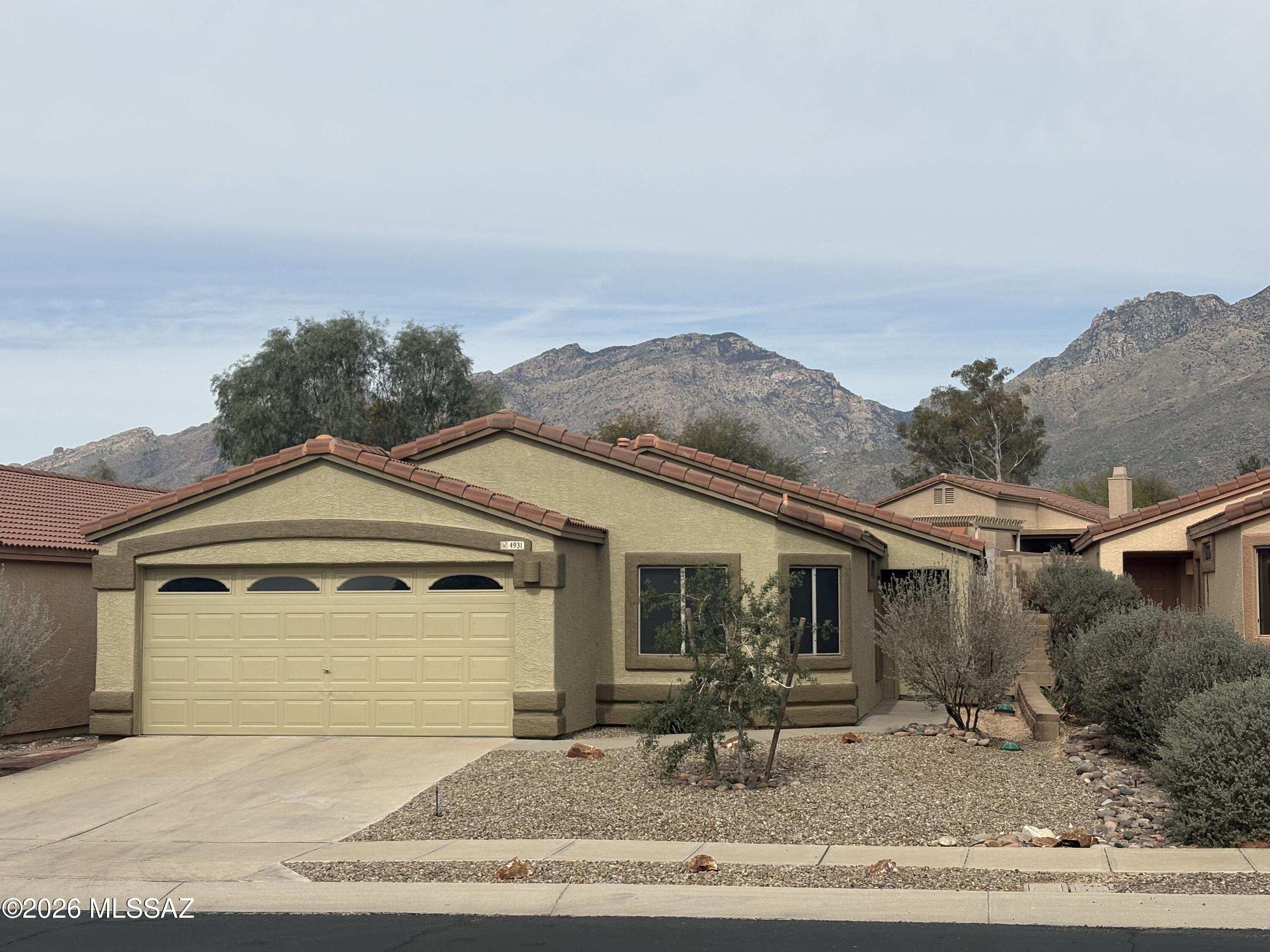 Located in the coveted Catalina Foothills and its top-tier school district, this residence offers mountain-view serenity and modern suburban convenience. Experience the Richmond American ''Emerald'' floor plan—a thoughtful single-story design offering 1,538 sq. ft. of seamless living. With 4 bedrooms, 2 baths, and a 2-car garage, the open-concept layout centers on a cathedral ceiling great room, dining area, and spacious kitchen. By eliminating wasted hallway space, this home prioritizes the areas where you spend the most time. This ''must-see'' property represents a rare opportunity to own a 4-bedroom home in the 85750 zip code, minutes away from the world-renowned Sabino Canyon Recreation Area and Ventana Canyon golf courses; at an affordable price point.