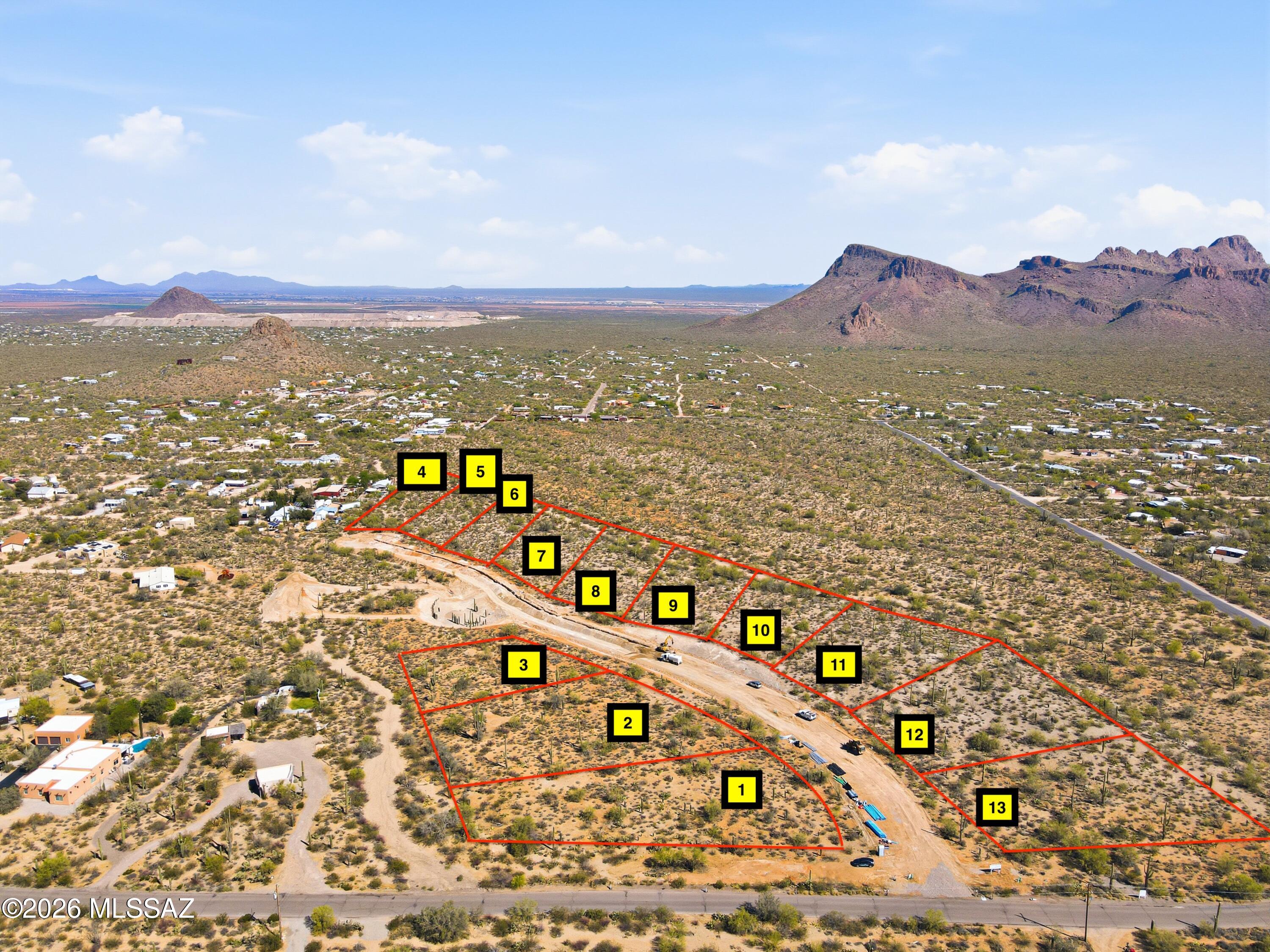 NEW CUSTOM LOT SUBDIVISION of 1+ acre lots: all with PANORAMIC mountain views. LUSH vegetation dotted with SAGUAROS and LEVEL or GENTLY SLOPED building areas. Choose RIDGETOP sites with views across Avra Valley, and the peaks of NEARBY Saguaro National Park or nestle in flat, well vegetated sites for PRIVACY.  Only 11, Phase 1 parcels available, priced from $152,000 to $164,000. Sites serviced by water, electric, phone and cable with HOA fees of only $125 per year. Single level homes required with a minimum 1800 sq. ft. and 20'  height restriction.   Choose your builder or ask about the available Dell Mar Homes models. Approx. 13 minutes west of the Ina/I-10 intersection for convenient Downtown, U of A and Airport access. Shown by appointment only during construction. CALL TODAY.