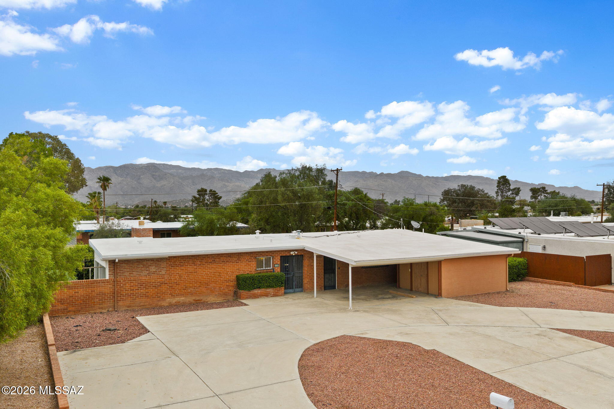 Located in the established Green Hills neighborhood, the 0.25-acre lot offers a little more breathing room than many Eastside neighborhoods & with NO HOA! Whether the midcentury vibes are preserved or the whole place gets a facelift, this brick construction home offers a split bedroom floorplan, North/South orientation & some of the big-ticket items have already been addressed, including a new AC in 2020 & water heater in 2019. Enjoy mountain views! The circular driveway provides ample parking, (RV space available), while the workshop/storage area offers plenty of flexibility for hobbies, projects or extra storage. A great opportunity to bring your vision to an Eastside home with character, space & potential!
