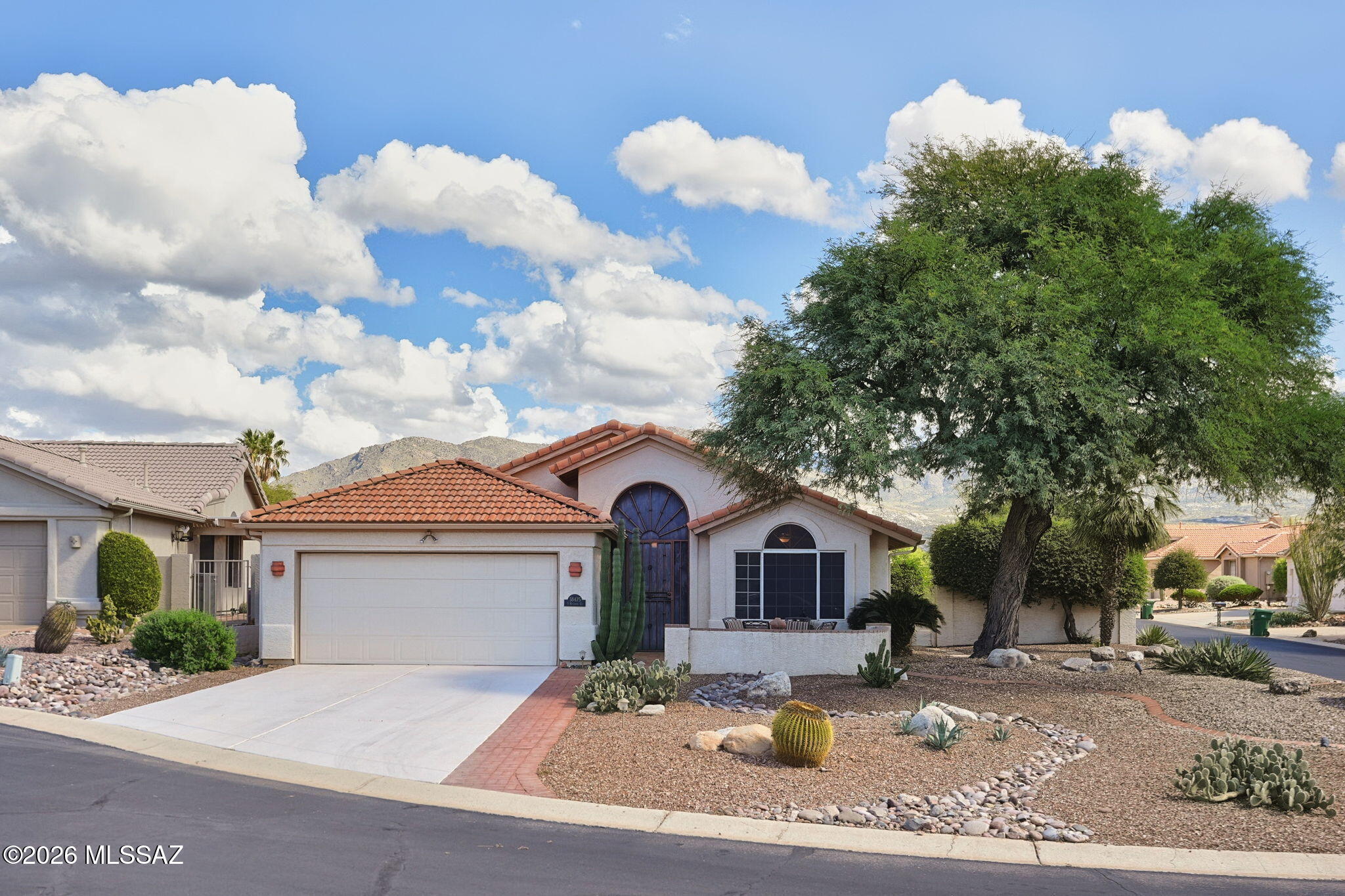 Delightful, expanded Shalimar model with amazing east facing mountain views! Home is located on a cul-de-sac & features engineered stone kitchen counters, white cabinets w/complimentary hardware, stainless steel appliances, 5-chair peninsula & pantry closet. Great room boasts tiled flooring & cozy gas beehive fireplace. Built-in corner desk, window seat & beautiful cabinets in office/den. New shower in guest bathroom. 2 car garage w/rainbow coated flooring, utility sink, attic storage & hot water recirculating sys. Enjoy the extended covered brick patio, soothing fountain & warming gas firepit w/added seating for guests. This home has an abundance of charm and character and compliments the SaddleBrooke lifestyle!