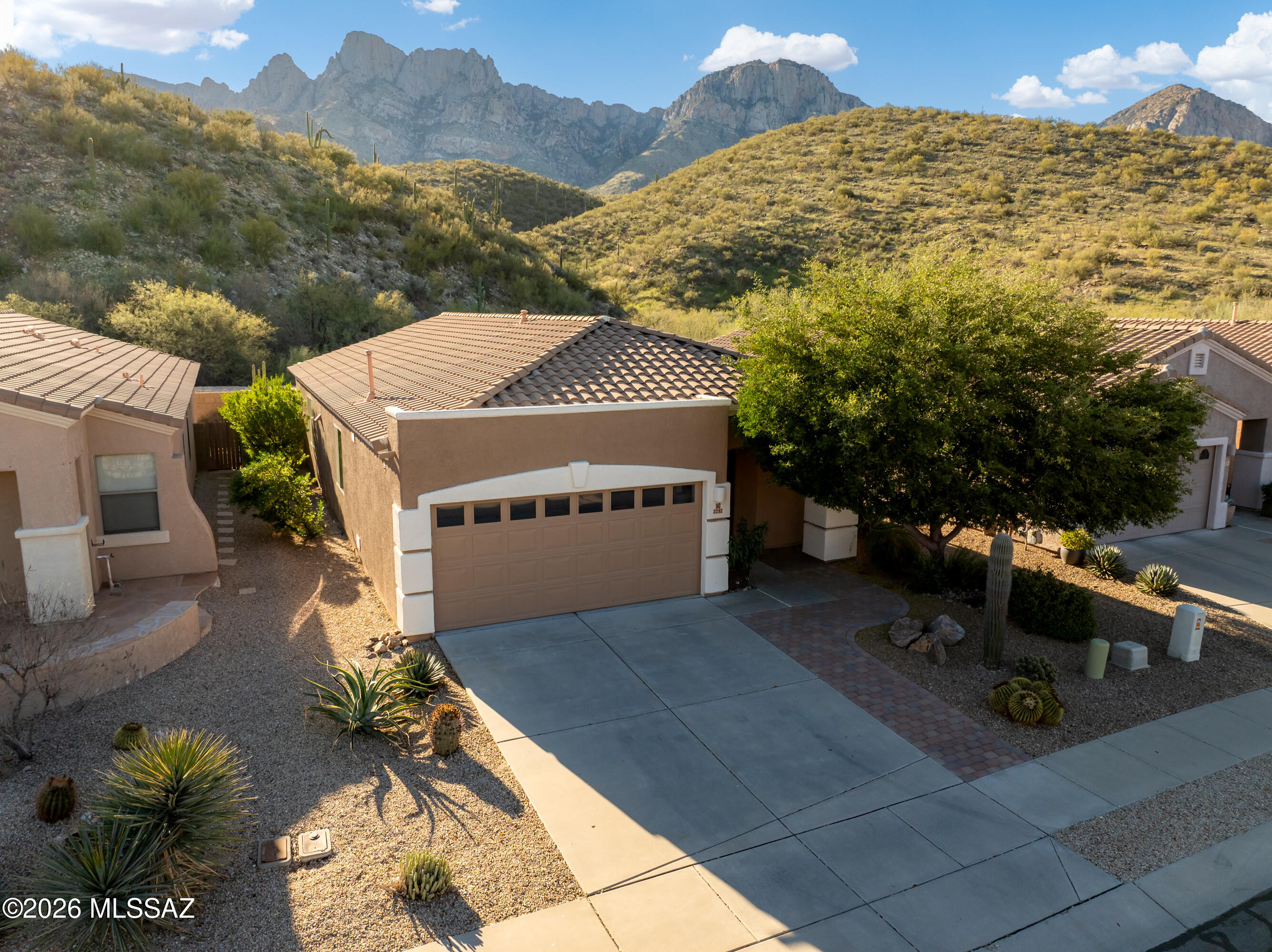 STUNNING UPGRADES AND RENOVATIONS WITH EXPANSIVE UNOBSTRUCTED VIEW TO TABLE TOP MOUNTAIN IN THE CATALINAS from one of the select top properties in the back corner of Rams Pass. This sheek and contemporary themed home features 3 bedrooms and two baths with split sleeping areas, an open floor plan, den and an abundance of unique touches in this updated kitchen highlighted with quartz countertops and new cabinets. Property backs up to an open space and is located less than one mile from the Catalina State Park. The home is within minutes of convenient shopping, restaurants and the Basis Charter School. The neighborhood boasts a park, adjacent hiking trails and is a friendly, safe and beautiful place nestled at the base of the Catalina mountains.