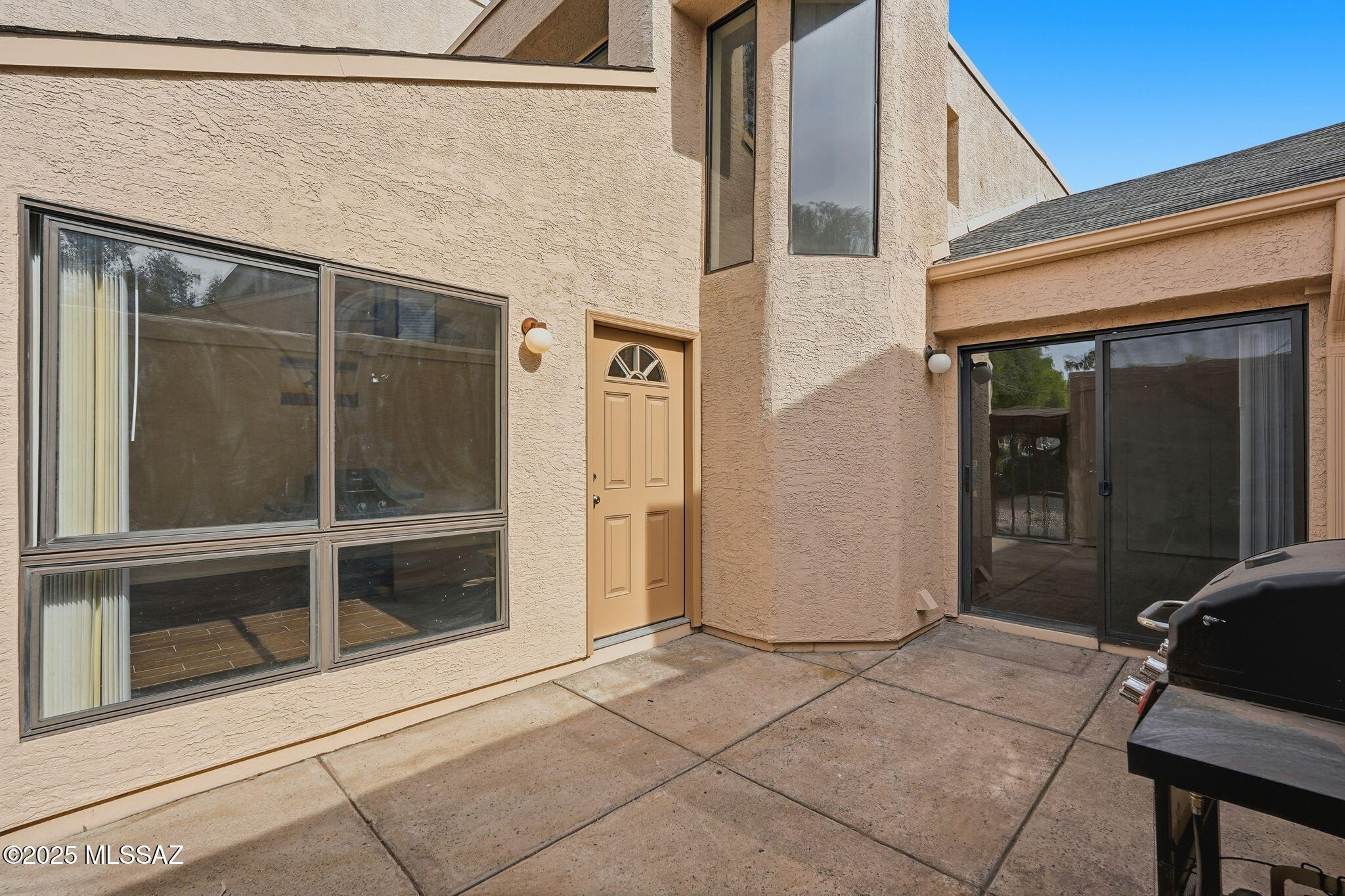 ***Seller will pay $5000 towards buyer's closing costs! Great for students, seasonal living, vacation rental. Close to Udall Park, Mount Lemon, Sabino Canyon & more. Enjoy the quiet that comes w/ being located at the back of community. Responsive HOA provides excellent value, covering water, trash, termites, pool, exterior paint, & roof. 2BR/2BA contemporary condo offers privacy w/ covered parking just steps from gated courtyard entry. Well-maintained w/ neutral finishes, consistent flooring,  high ceilings & new picture window allowing for natural light. Updated kitchen includes ample cabinetry & opens to the living area. Spacious primary bedroom w/ walk in closet. Second bedroom opens to patio & has great closet space. Private patio is perfect for relaxing.