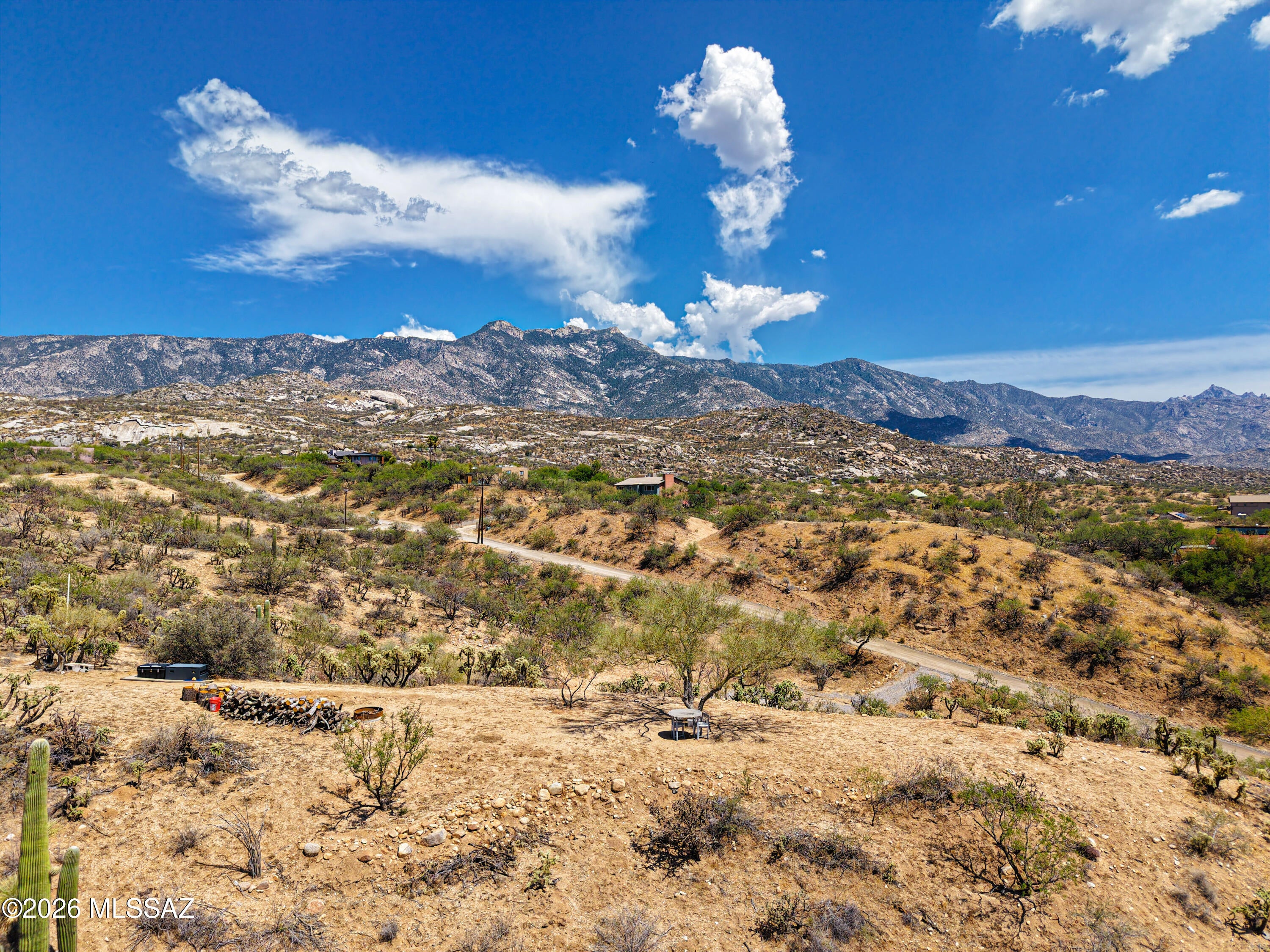 Overlooking the CDO River Valley to the west and with sensational views of the Catalinas to the east, this unique 1.31 acre parcel holds great possibilities. The sloped lot can lead to a pretty amazing home design, probably utilizing a lower garage area and placing living space above to gain elevation for some epic views. An upper shelf with some flat land can be used to create a simply stunning patio viewing area & outdoor space. Electric and water are both right next to this lot as well. It's an opportunity to get away from the noise of the city and enjoy a quieter, more rural environment. The neighboring lots have shown this soil is easily shaped, so site preparation should be relatively reasonable for this type of property. Come on out to view this lot in person.