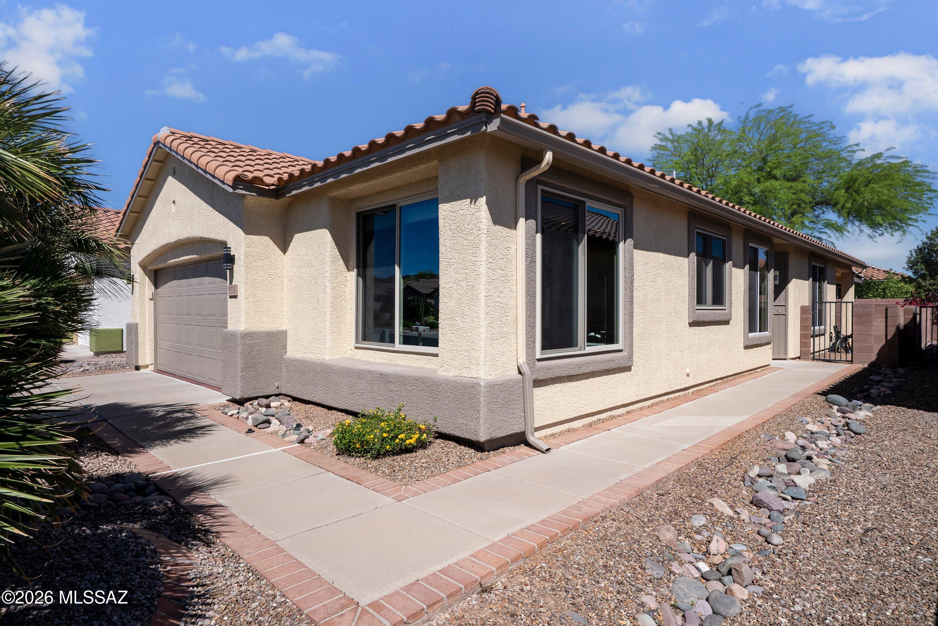 Welcome to this charming Santa Rita model offering 1,598 sq. ft. of comfortable living in a peaceful 55+ Del Webb community. This 2-bedroom, 2-bath home with a versatile den provides the perfect blend of character, efficiency, and location.
The inviting kitchen is a true standout, featuring distinctive wallpaper that creates the warm ambiance of a French café, making it a delightful space for morning coffee or casual dining. The open layout flows easily into the living areas, creating a comfortable environment for both everyday living and entertaining.
Energy efficiency is a major bonus with owned solar, helping keep utility costs manageable year-round. The exterior has just been freshly painted, and the interior was updated within the past two years.