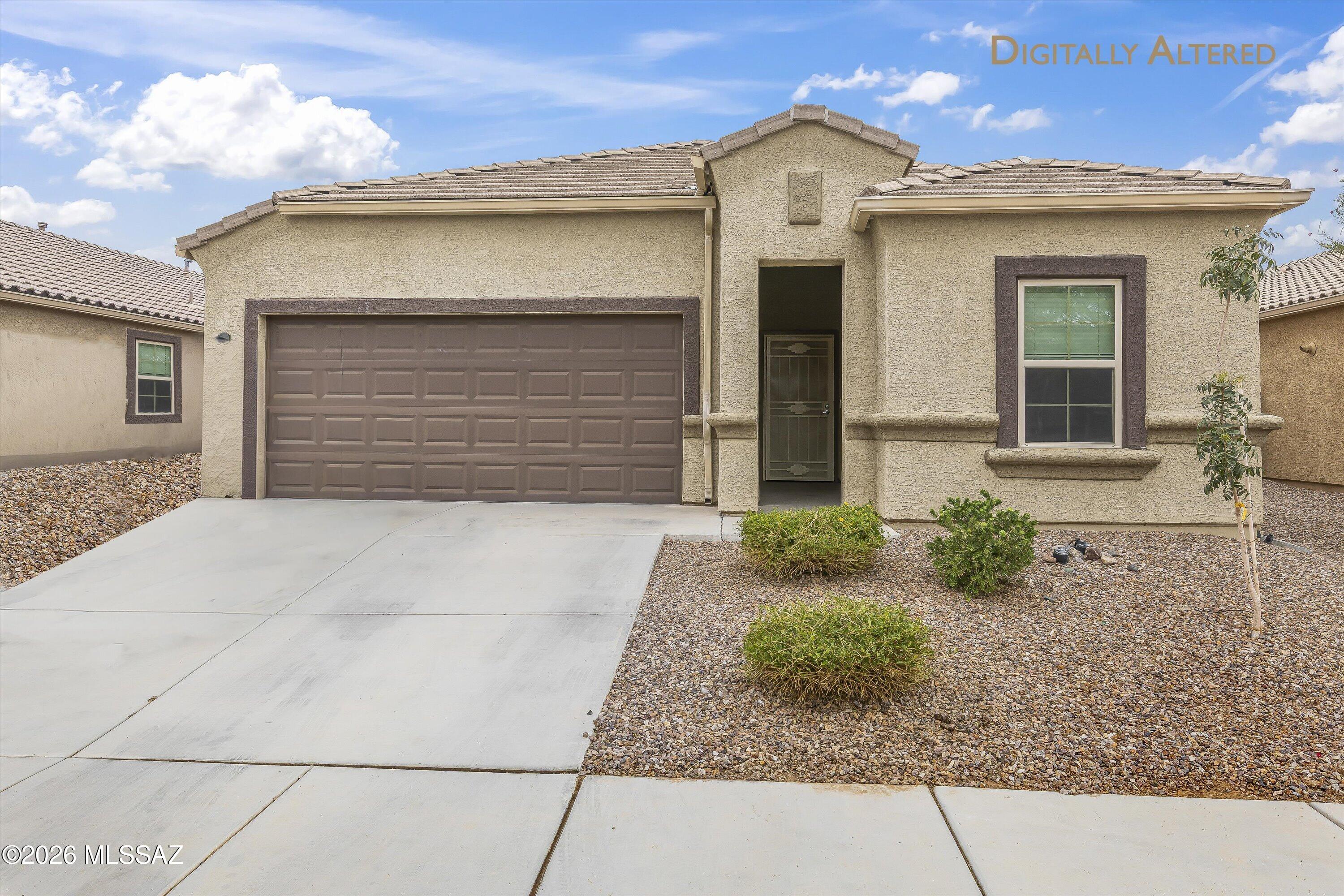 Move-in ready 4-bedroom, 2-bath home in the peaceful Marana neighborhood of Saguaro Bloom! Enjoy low energy costs with financed solar panels and a whole-home water treatment system with reverse osmosis. The landscaped backyard features an extended patio with pergola—perfect for entertaining. Community amenities include pools, fitness center, activity center, parks, and playgrounds. Conveniently located with easy freeway access and just minutes to shopping, schools, and dining. Plus, take advantage of an assumable VA loan at an incredibly low 2.5% interest rate!