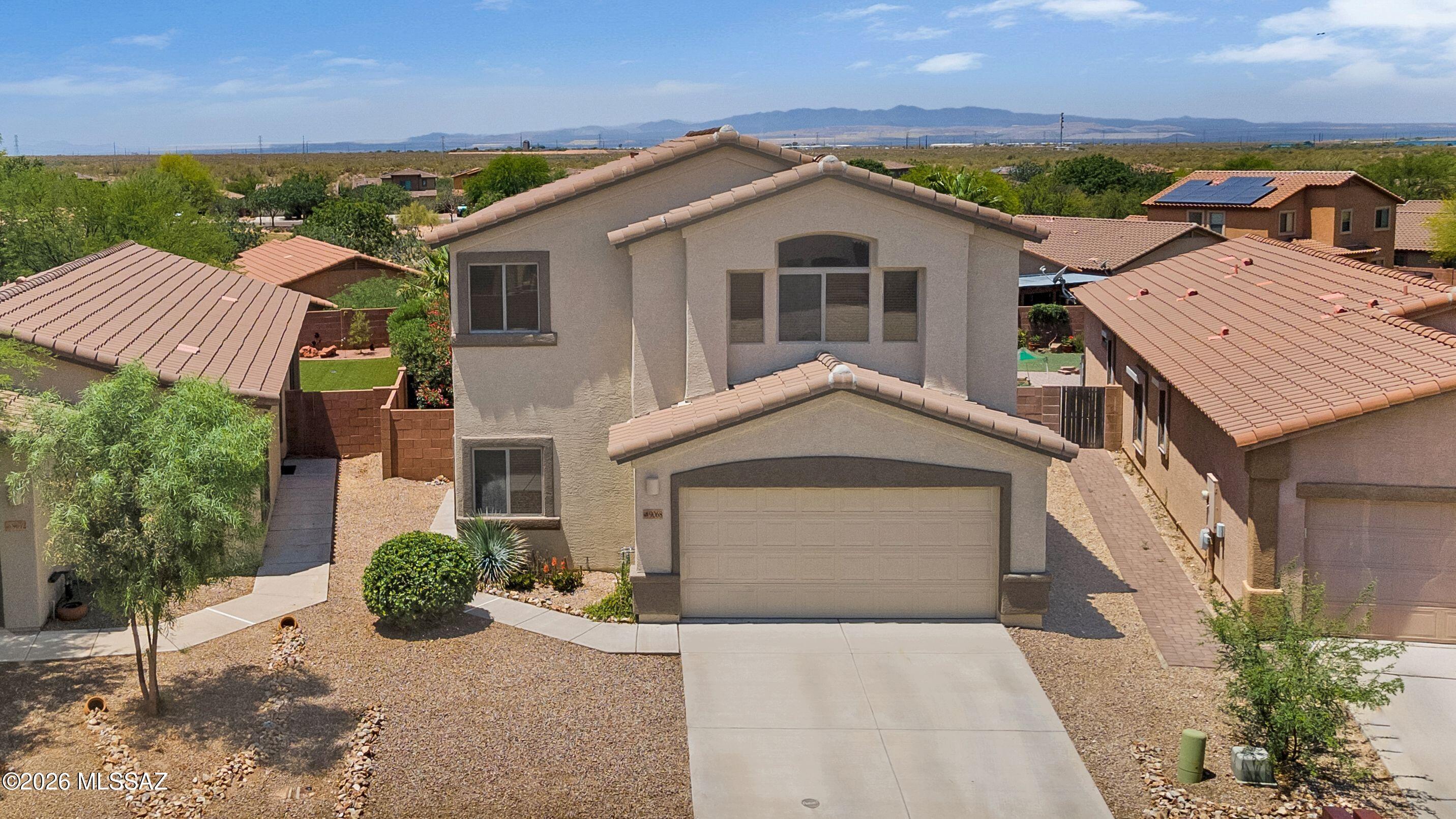 Welcome to Sycamore Park, the hidden gem of the award winning Vail School district! With a huge park at the heart of the neighborhood, the community is surrounded on 3 sides by state land located at the end of the road. Easy access to the highway but tucked away for peace and quiet. This fantastic lot sits above its neighbors so you barely notice they are there from your huge backyard with full length covered patio and built in grill (replaced 2025). Step inside this clean and well maintained home and cool off with a newer HVAC system. Well designed kitchen off the living area, plus full bedroom and bathroom downstairs. Upstairs you still have a huge loft with the primary & 2 bedrooms. But what you can't see is how this feels like home; comfortable, spacious & welcoming! See for yourself!