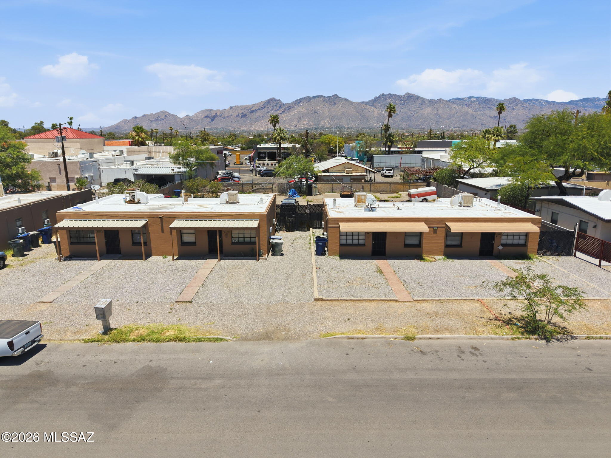 Fourplex, set of 2 duplexes, each unit 1 Bedroom, 1 Bath, centrally located with good parking, fenced backyards and laundry rooms.  All units have re-piped water lines, evap coolers with 2 window AC assist and wall heaters.  Electric and Gas separately metered, tenants pay., Water/sewer/trash common per building and landlord pays.  Roofs both serviced & coated, exterior paint fresh.  Interiors on 3 out of 4 units are updated with all LVP flooring and new paint and several new appliances.   Kitchens include fridge and stove with nice condition original wood painted cabinets.   Fenced backyards, room for at least 2 vehicles parking off street for each unit.  Great location, easy to rent and room to grow!