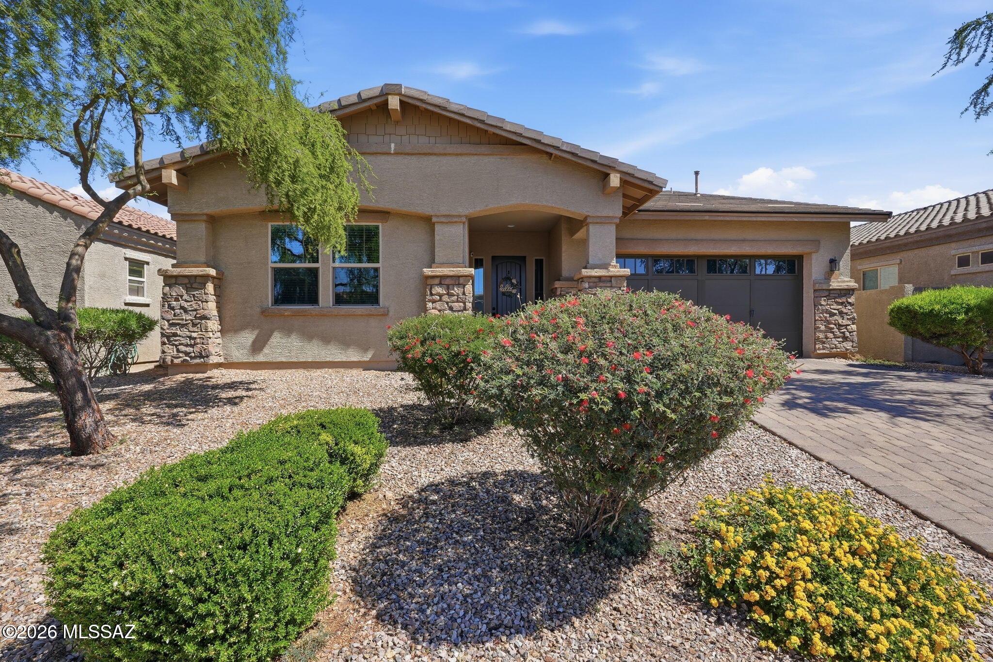 Welcome home to this pristine, turn-key contemporary gem located in Oro Valley's highly sought-after and gated, Cove at Centerpointe Vistoso neighborhood! Built in 2016, this beautifully maintained 3BD/2.5BA (2,729 sqft) home has a meticulously upgraded living space, blending high-end functionality with the relaxed elegance of the Arizona desert lifestyle. From the moment you step inside, you are greeted by an expansive open-concept floor plan that feels incredibly light, bright, and airy. The heart of the home is a spectacular chef's kitchen featuring striking light cabinets, premium stainless-steel appliances, a massive social island with elegant pendant lighting, and a generous walk-in pantry. It flows effortlessly into the main living areas, making it the perfect hub for family gatherings or weekend entertaining. The thoughtful floor plan provides immense flexibility, including beautifully upgraded bathrooms, a dedicated office, an impressive den, and a massive laundry room outfitted with an abundance of custom cabinetry and wrap-around counter space for ultimate daily convenience. Outdoor living is a true delight in the private backyard oasis. Step through the sliding doors onto a deep covered patio that leads out to an extended, professionally laid paver patio area--providing a space for casual dining, stargazing, or soaking in the peaceful desert evenings. Ideally located just a short walk from the community pool, spa, park, splash pad, and recreation center, this home offers not only luxury and privacy, but also convenient access to exceptional amenities. Minutes from the Vistoso Nature Trail, park, premium shopping, and top-rated schools, this magnificent home is move-in ready and waiting for its next chapter!