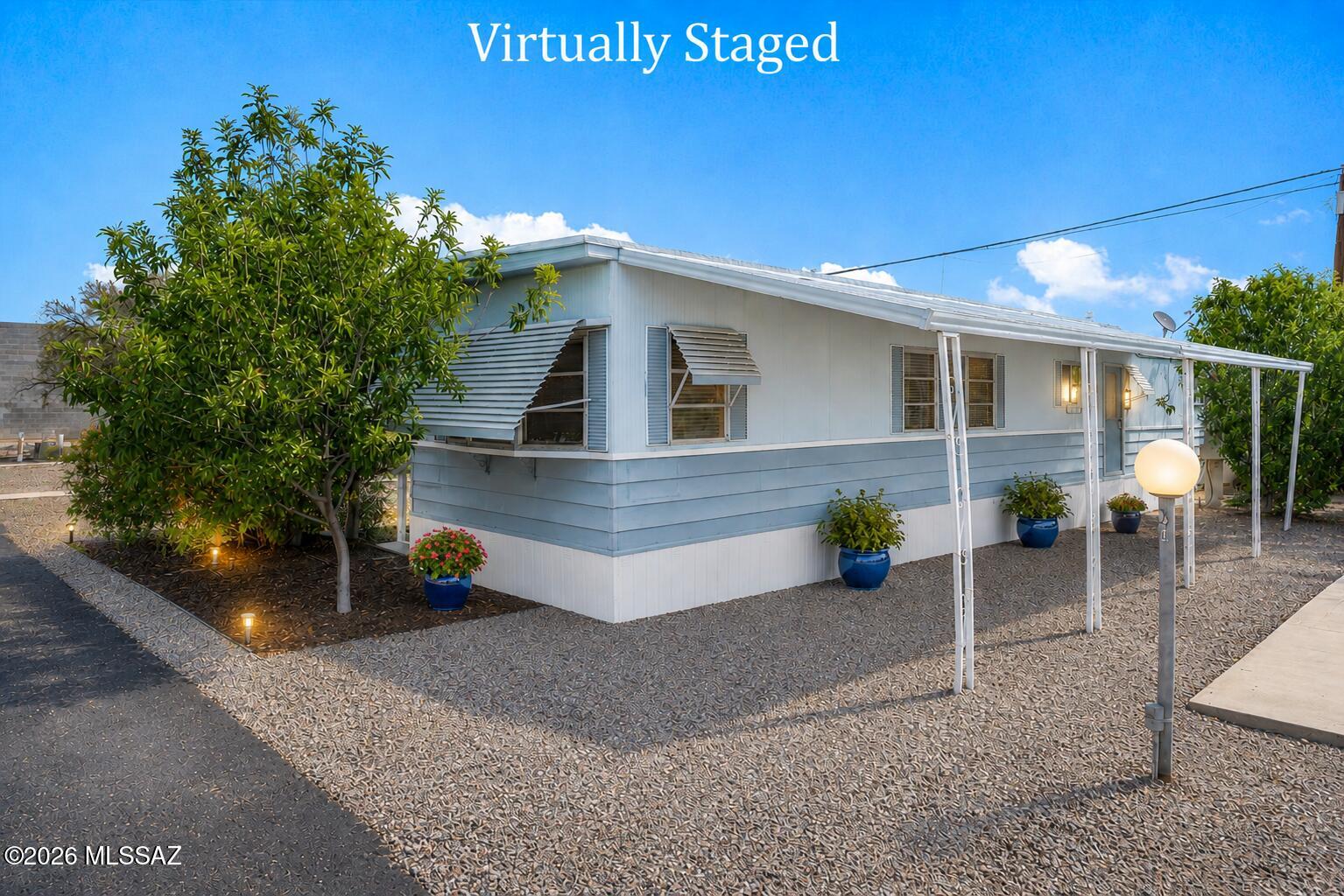 Welcome to Park Way Vista, a desirable 55+ active adult community in North Tucson. This well-maintained 2-bedroom, 1.5-bath home offers approximately 750 Sq Ft of comfortable living space and features a covered carport with room for two vehicles, plus a private backyard perfect for relaxing, gardening, or entertaining. Conveniently located near the Catalina Foothills, Rillito River Park, gym, shopping, dining, medical facilities, and I-10. Community amenities include a clubhouse with a full kitchen, scheduled social activities, spacious meeting room, pool table, laundry facilities, pet-friendly policies, and professional on-site management. No rentals allowed.