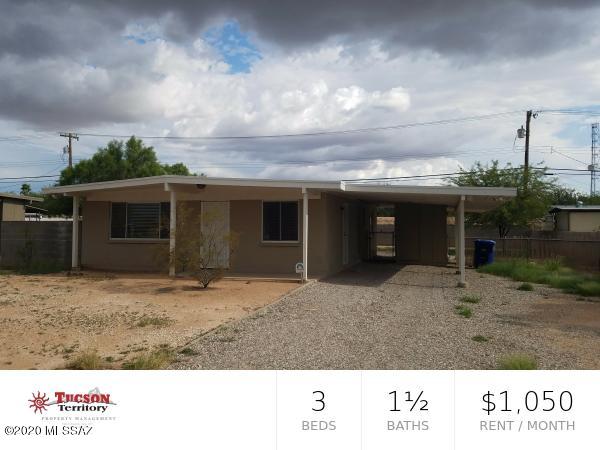 Charming - remodeled 3 bedroom and 1 1/2 bath home in Central Tucson with AC! Open-concept ''Great Room'' layout featuring a neutral color palette and durable concrete/tile flooring throughout main areas. Bright eat-in kitchen equipped with contemporary appliances and direct access to covered parking. Three spacious bedrooms featuring plush, newer carpeting and ample natural light. Massive, low-maintenance backyard with gated access--perfect for privacy and easy upkeep. Central A/C and a single-car carport. Minutes from Davis-Monthan AFB, major hospitals, and central transit lines. Situated in a high-accessibility zone for commuting and essential services.