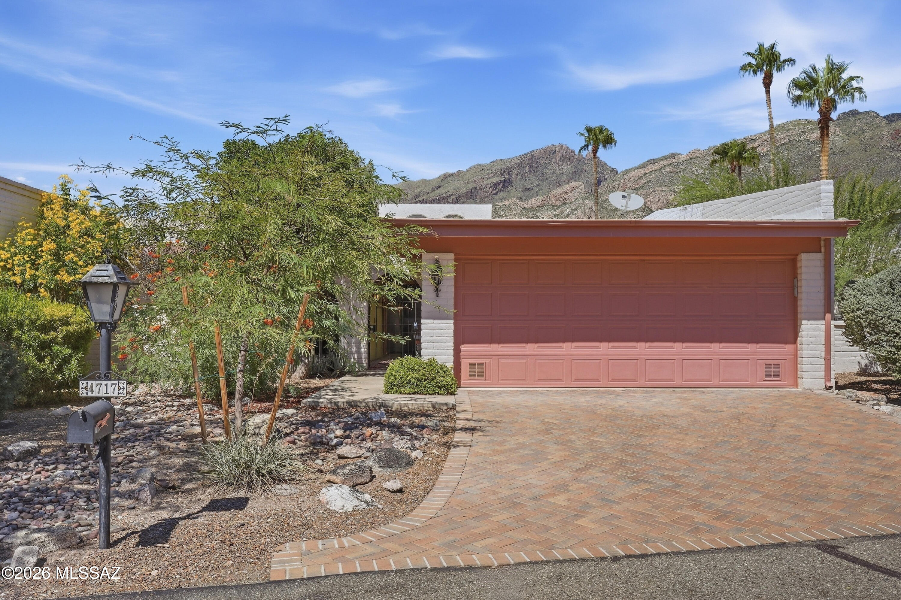 Welcome to this charming 3-bedroom, 2-bath townhouse in the desirable Catalina Foothills, where breathtaking mountain views and classic Tucson style come together. Saltillo tile flows throughout the home, creating warmth and character, while the kitchen features abundant natural-wood cabinetry, generous counter space and a Southwestern-inspired finish with rich blue tile accents giving the kitchen a distinctive feel. The baths offer sunken tubs/showers for a touch of timeless charm. A spacious living room features a wood-burning fireplace, creating a warm and inviting gathering space, while the formal dining room provides an elegant setting for entertaining and special occasions. Enjoy the spectacular views and the beauty of this peaceful outdoor setting. Newer HVAC & hot water heater.