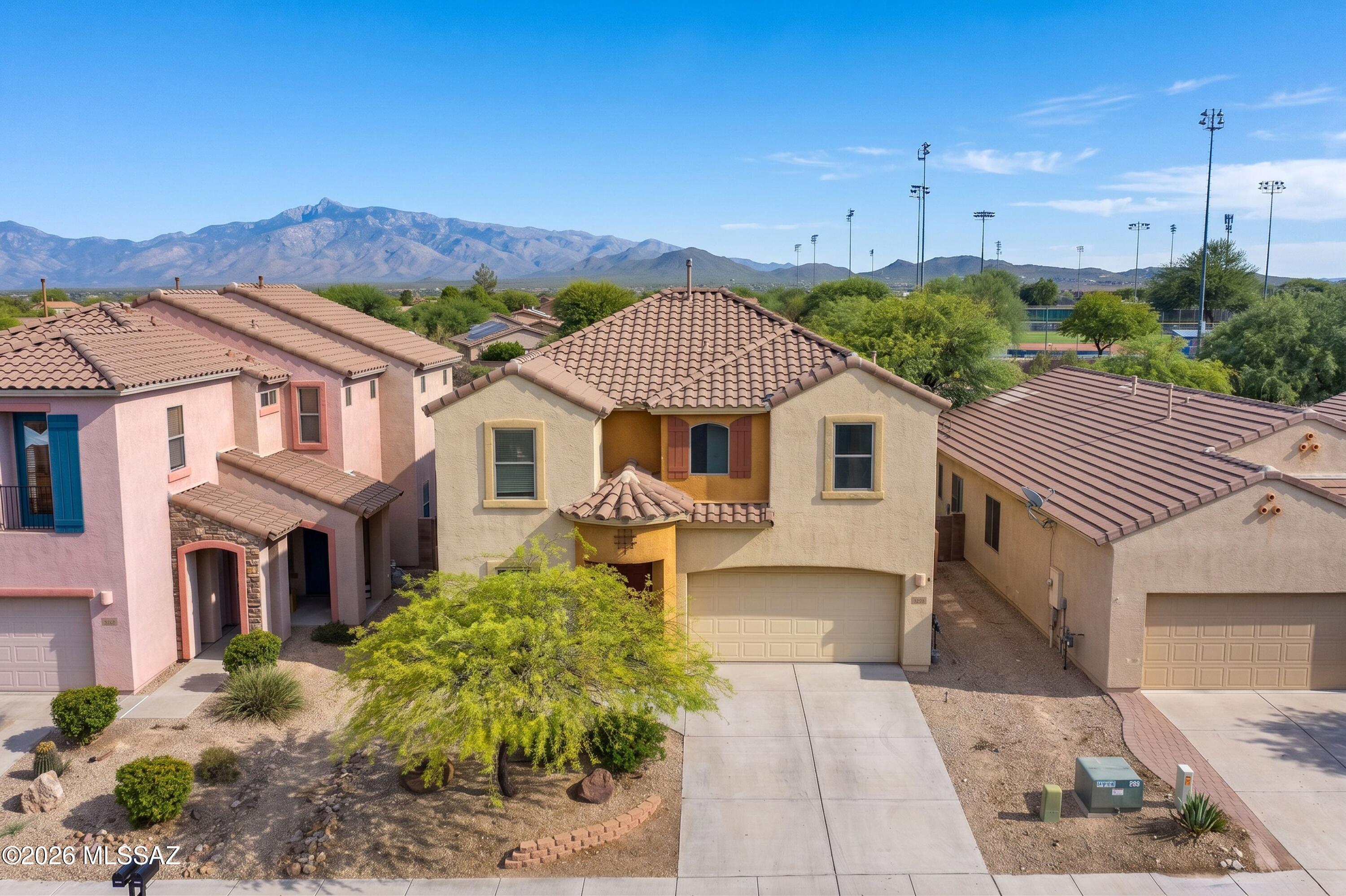What a VALUE! Located in the award winning Vail School District this 4 bedroom 3 full bathroom home is within walking distance of Cienega High School and Overlook Park. Many unique features to include; a full bedroom and full bathroom with a shower downstairs, dual closets in the primary bedroom, upstairs laundry, and a deck off the primary bedroom. Upgrdes include; granite counters in kitchen, stainless steel appliances, gas range, and NEW carpet. Text for an appointment today before it is long gone!