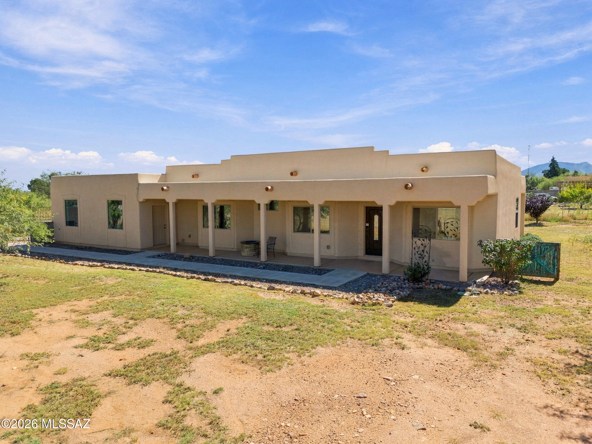 Competitively priced with a motivated seller welcoming serious offers and willing to help you buy down your interest rate! Don't miss out on this unique property set on nearly an acre with a true country feel and city amenities close by. This custom built home is an RV owners dream. Oversized pull-through gates on each end of the property welcome even the largest 50 class A motorhome with a trailer. Plus $50,000 in new 7 foot block wall and wrought iron fencing wrap the property with maximum privacy and a sense of security. Public water, no covenants or a private well to worry about and NO HOA's. The extended bay 3 car garage is a true shop for a mechanic or hobbyist at 700 sqft, with 8 foot tall doors and 220V/60 amp outlets, ready for tools, welders, RV hookups and EV charging..... A spacious patio wired for a Hot Tub where you can enjoy views of the breathtaking Huachuca Mountains. A separately fenced garden, fruit trees, fire pit, and a gravel landscaped entry complement the grounds. Inside this home you will find 10 foot ceilings and easy to maintain tile floors throughout, which give every room a bright and open feel. The kitchen is a real standout, with a 5 burner chef's gas range, granite countertops, soft close drawers, large cabinets and stainless appliances. The spacious primary suite features executive height double sink vanity with granite countertops and tiled shower. Completing this beautiful one of a kind Arizona home is insulated stucco, central air, ceiling fans in every room and large front and back covered patios. This property has a combined collection of incomparable features you won't find anywhere else. Make it your dream HOME!