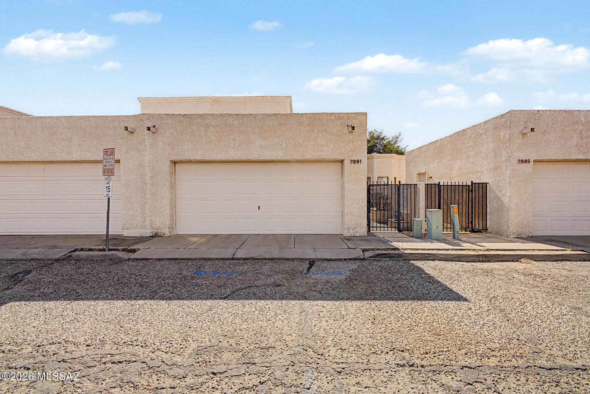 Fantastic opportunity to own this beautifully updated 3-bedroom townhome in desirable Le Mirador! Recent improvements include new carpet, fresh interior paint, new bathroom vanities, new tile in both bathrooms, and new ceiling fans. Step inside to soaring vaulted ceilings, recessed lighting, durable tile flooring, and a bright, welcoming living room. The eat-in kitchen offers ample wood cabinetry, a pantry, and plenty of storage. The spacious primary suite features soft new carpet and a private bath. Enjoy Arizona living in the low-maintenance backyard with an extended paver patio, outdoor grill, and dry bar--perfect for entertaining. Complete with a 2-car garage featuring built-in storage shelves and a charming front patio, this move-in-ready home is one you won't want to miss!