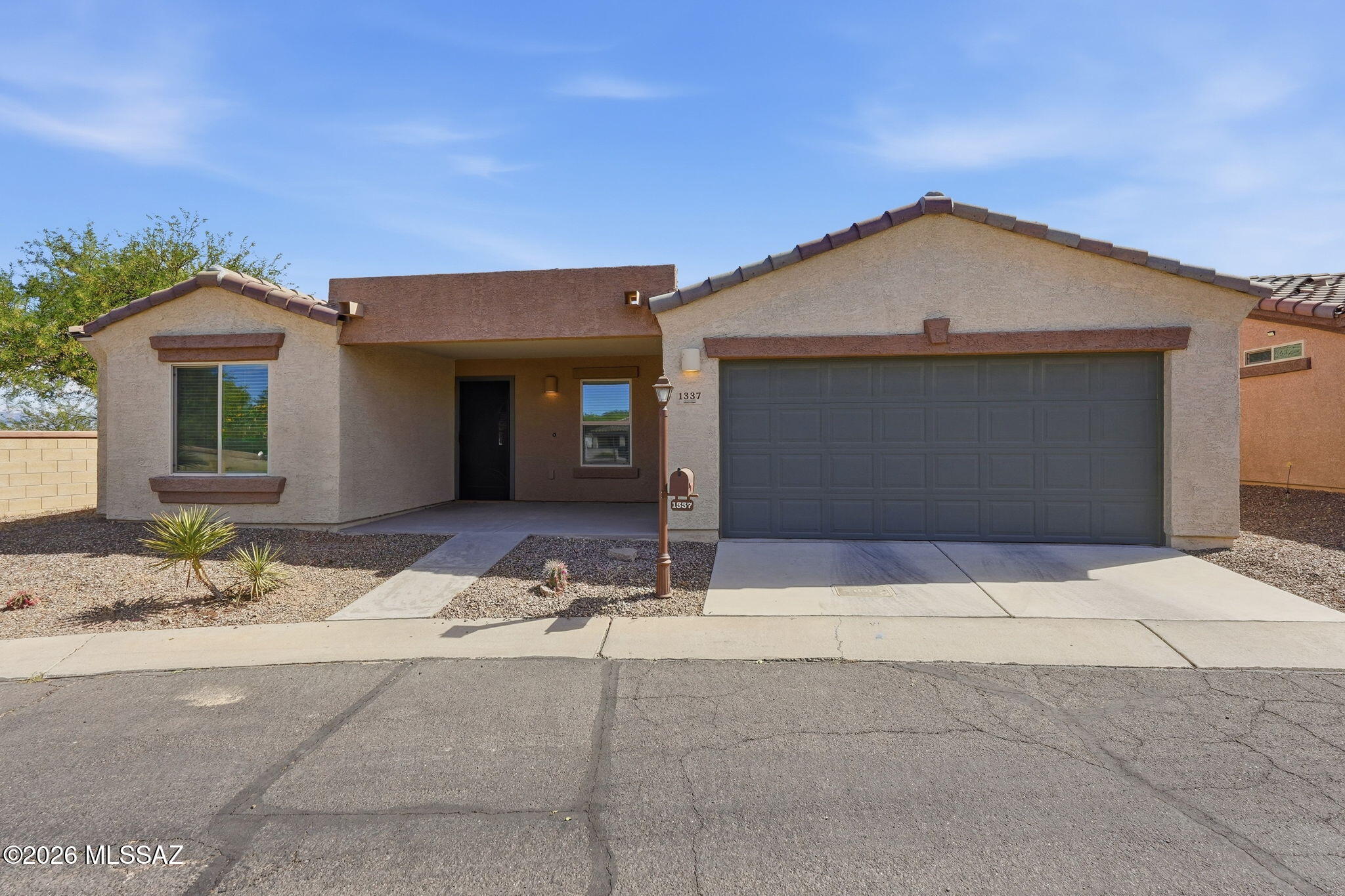 Available for long-term lease. 1388 square foot home located in the gated, 55+ Active Adult Community of Rancho Resort in Sahuarita. Home boasts a split floor plan with 2 bedrooms, 2 baths, a den, plus 2-car garage. Step inside to find a modern kitchen that opens to the dining room and great room. The kitchen features granite countertops, upgraded cabinets, pantry, breakfast bar, and stainless-steel appliances including gas range, microwave, dishwasher, and refrigerator. Reverse osmosis water is available at the kitchen sink. Off the great room you find a comfy den or possible office space. Throughout the home you will find custom window treatments, upgraded light fixtures and ceiling fans. Enjoy the delightful front-patio outdoor living space. Relax on the patio or take advantage of all the amenities that Rancho Resort offers. The clubhouse and amenities including a pool, are just a short walk away. Rancho Resort also offers cycling paths, volleyball courts, pickleball courts, bocce ball, tennis courts, horseshoes, a putting green, their own "Village Green" park and more.