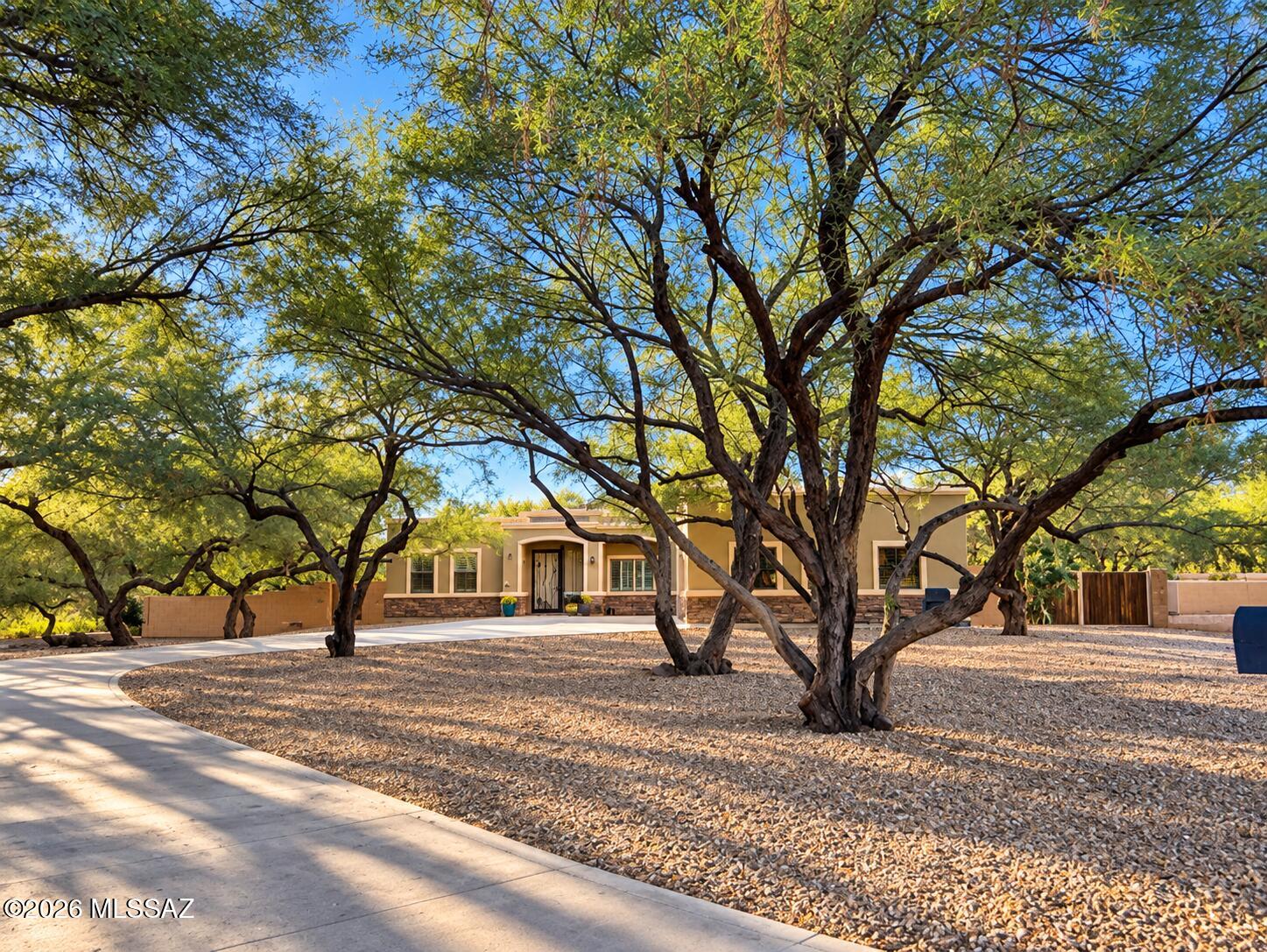 Exceptional property on one of 49ers Country Club's premier lots,
offering privacy among 25+ mature mesquite trees. Spacious 4BR
split floor plan features two oversized bedrooms with Jack-and-Jill
bath, separate guest suite with 3/4 bath, and expansive primary
suite with office/den,Jacuzzi tub, walk-in shower and dual vanities.
Plantation shutters, concrete flooring, ceiling fans and 3 custom
built-in desks. Oversized 3-car garage accommodates large trucks
and includes workshop with built-in storage. Long concrete
driveway and 12-ft RV gate provide ample parking for RVs, trailers
and toys. Private backyard features an expansive covered patio with
sunshades, fans and TV, 15x55 turf area, brick walkways, fire pit and
separately fenced poot/spa. Paid solar, new HVAC units (2022),
water heaters (2025), roof under warranty and approved guest house
plans. Not directly on the golf course, yet within walking distance of
holes 3 and 4. Enjoy community amenities including heated pool,
restaurant, fitness center, swim team and social events. A rare
combination of privacy, space and convenience in desirable 49ers
Country Club! Relocation forces sale
