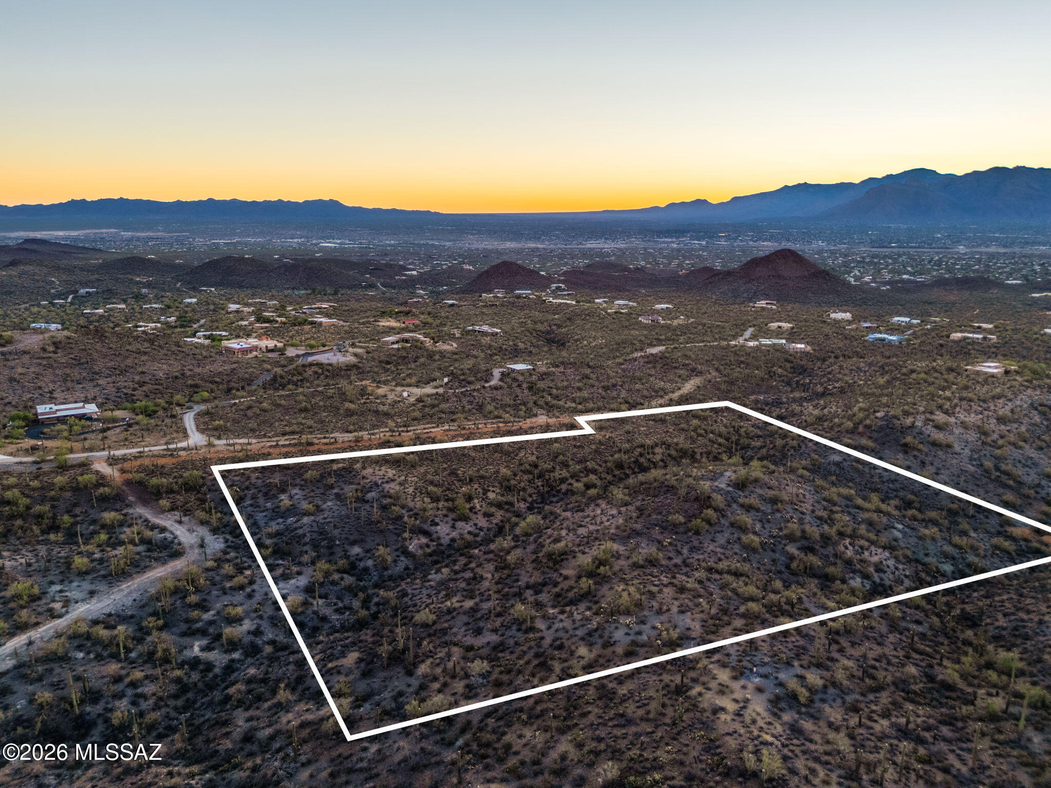 Welcome to one of the most spectacular undeveloped homesites on Tucson's coveted west side. This extraordinary 10+acre Sonoran Desert estate parcel offers a rare opportunity to create a legacy property surrounded by breathtaking natural beauty, just one parcel from Saguaro National Park. Elevated to capture sweeping panoramic views of the Tucson Mountains, sparkling city lights, and unforgettable Arizona sunsets, this remarkable property is blanketed with thousands of majestic saguaro cacti and vibrant native desert vegetation, providing an authentic Arizona landscape unlike any other. Comprised of two contiguous parcels totaling 10.91 acres, this exceptional property offers endless possibilities.  More--> Design and build a private luxury estate, create a secluded family compound, or explore the potential to divide the property into multiple homesites (buyer to verify all zoning, subdivision, and development requirements). All property corners have been clearly marked for added convenience.
One of the property's most valuable and unique features is the inclusion of three fully paid Tucson Water service connections already on-site--an incredible advantage that can save significant time and development costs. Electric service is conveniently available at both the northeast and southeast corners of the property, while paved road access extends nearly to the lot, providing easy year round accessibility. Enjoy the peace and privacy of the Sonoran Desert while remaining just minutes from Downtown Tucson, Interstate 10, shopping, dining, entertainment, and countless outdoor recreation opportunities. World-class hiking, mountain biking, wildlife viewing, and scenic desert trails are all within easy reach, making this an exceptional setting for those seeking both adventure and tranquility.
Horse property by zoning with no HOA, allowing greater flexibility for your vision. A simple annual road and gate maintenance agreement of just $300 helps preserve access and the area's natural appeal. A survey illustrating a potential three-lot split is available for review, offering additional possibilities for future development (buyer to verify).
Large acreage parcels with panoramic mountain and city views, thousands of mature saguaros, paved access, city water already on-site, and future development potential are becoming increasingly rare. This is more than vacant land--it's an opportunity to build an extraordinary lifestyle in one of Tucson's most sought-after desert settings. Don't miss your chance to own a truly remarkable piece of the Sonoran Desert.