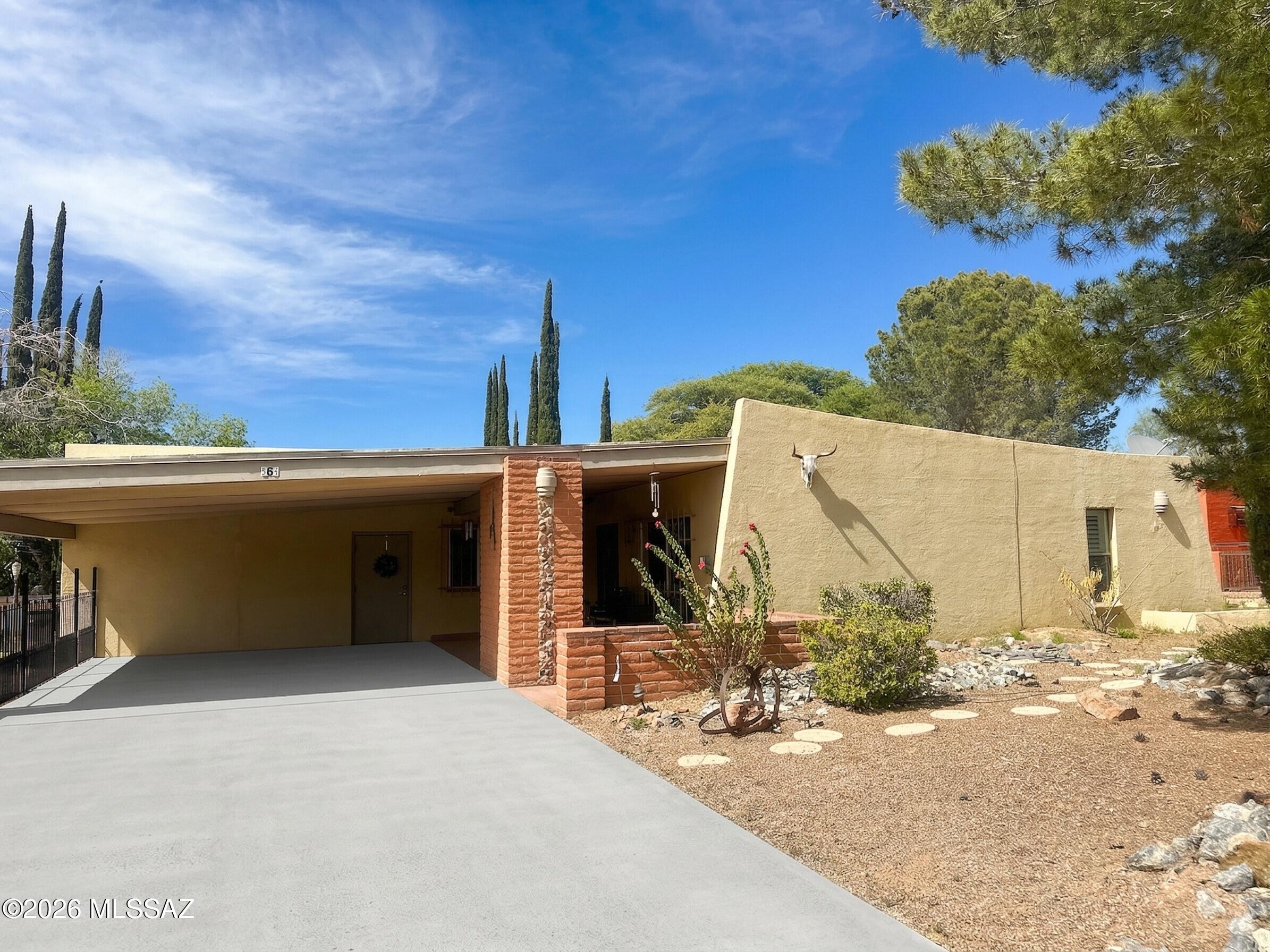 ZERO DOWN programs available! Located in the peaceful community of Kino Springs near Nogales, this charming home offers quiet country living perfect for retirement or those seeking space and tranquility. Enjoy no HOA and USDA or Legacy Advantage Program financing with zero-down options. The property features tile flooring throughout to help keep the home cool, and the area typically enjoys cooler temperatures than Tucson.

There's ample space for RV parking, a large storage room/shop, and an enclosed patio ideal for relaxing or entertaining. Conveniently located just miles from Patagonia Lake State Park and close to the border, making travel and family visits easy. Enjoy peaceful living with beautiful Southern Arizona surroundings.