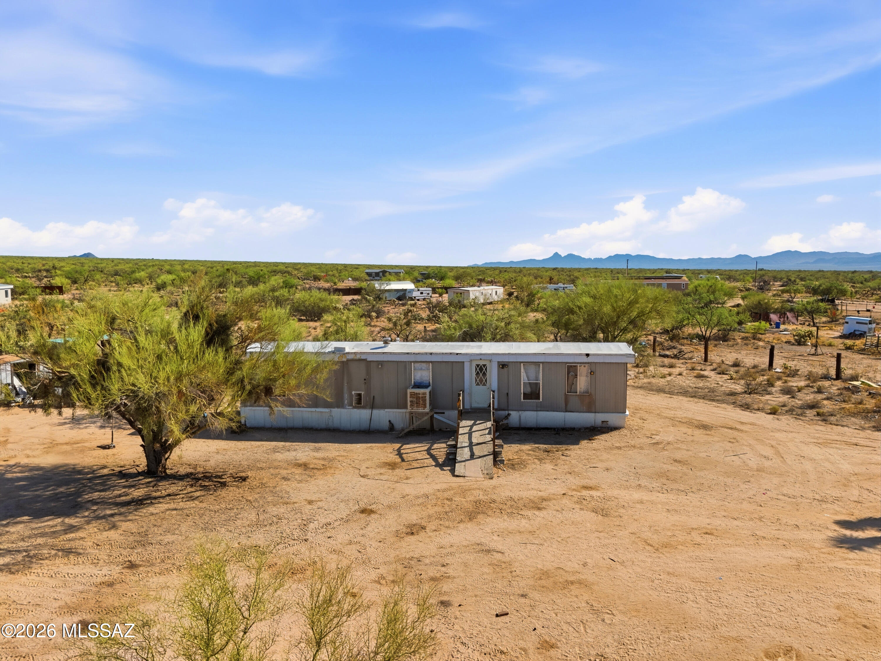 SELLER FINANCING: 20% down at 10% interest for 12 months. Calling all First time buyers, Local remodelers or major investors. This is a prime location in Three Points. Located in Diamond Bell Ranch keeps the community feeling while allowing you the freedom to take your acre+ to the next level with almost no restrictions. This property has water, septic, gas and electric already set up for perfect flexibility on new projects. While this home may need work, its priced to sell and primed for an investor to make their personal touches and a profit all in one. Don't miss this opportunity to own part of Arizona in an amazing area for a great price. Keep in mind you're less than 5 minutes from Sahuaro National Park.