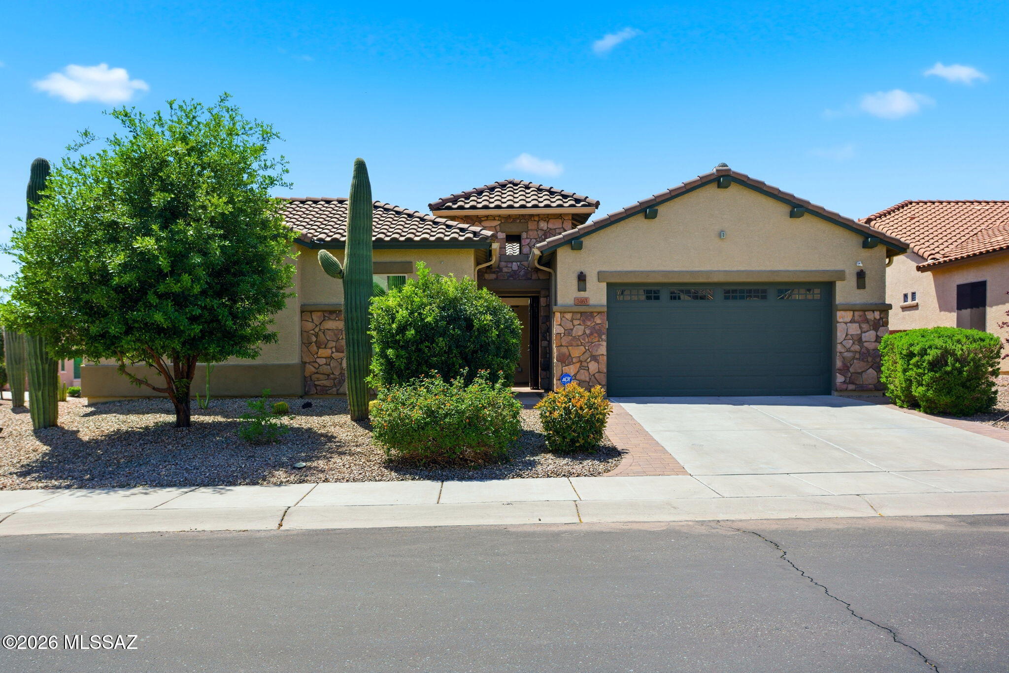 Nestled in the gated Tangerine Crossing community, this charming 4-bedroom, 3-bath home offers 2,927 square feet of versatile living designed for modern lifestyles. Situated on a prime corner lot, you're welcomed by a bright, private front courtyard before stepping inside to an open, light-filled interior that seamlessly flows through the dining, living, and kitchen spaces in a desirable split-bedroom floor plan. The spacious kitchen, anchored by a large island, serves as the heart of the home and is ideal for gatherings. A den and additional flex space provide the perfect setup for a home office, playroom, or secondary living area.

The backyard is truly an entertainer's oasis featuring a heated pool with waterfall feature, covered ramada with built-in barbecue, gas pizza oven, sunshade and low-maintenance turf. The 3-car garage offers ample storage & mini split, and the cherry on top--paid-off solar for added efficiency.

Just a short walk up the street you'll find a neighborhood park, with convenient proximity to freeway access, schools, shopping, and dining. Don't miss this bright, flexible gem in a prime location.