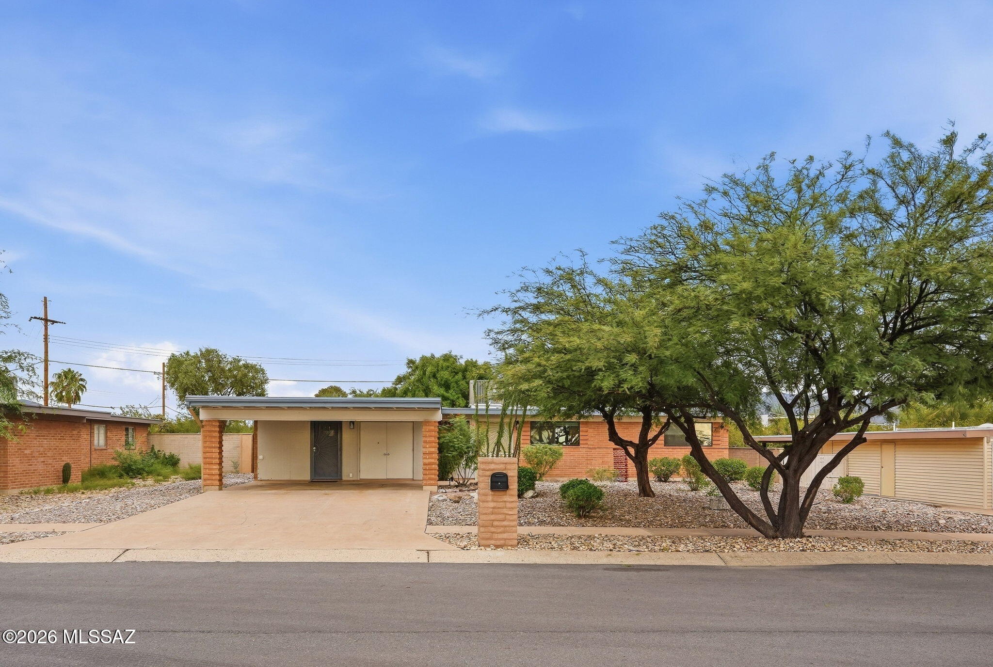 Welcome to this beautifully updated 4BR/2BA east-side Tucson home! Spanning 1,695 sqft in Carriage Park, this bright, move-in-ready gem features an expansive great room with wall-to-wall windows and automatic rolling shades. The modern kitchen shines with soft-close cabinetry, quartz countertops, stainless steel appliances and a long central kitchen island. Luxury vinyl plank flooring flows throughout--no carpet! Recently updated HVAC, water heater, interior paint, and appliances. Step out to an entertainer's backyard oasis, with an extended covered patio and sparkling pool.  The landscaped backyard features pavers, artificial turf, and stunning mountain views. Nearby shopping, dining, and parks. Turnkey and ready for you!