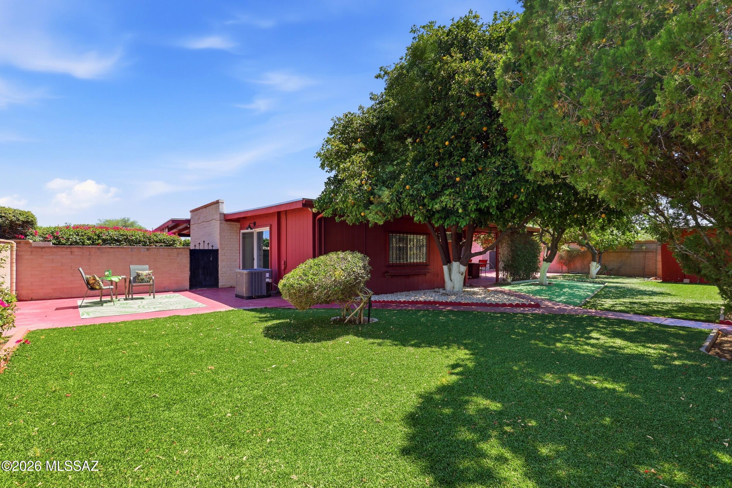 New roof, new dual pane windows, new carpet, faux wood blinds, remodeled kitchen and bathrooms! This 4 bedroom, 2 bath home has indoor laundry and a large bonus room that can be open or closed off for privacy. It makes a great , spacious family room, entertaining space, home gym, play room or office. Amazing back yard too --picture perfect and ready to enjoy with a large, shady patio, big citrus trees, artificial turf and a storage building. If you hurry, you can enjoy a 4th of July backyard BBQ  --there's plenty of room.