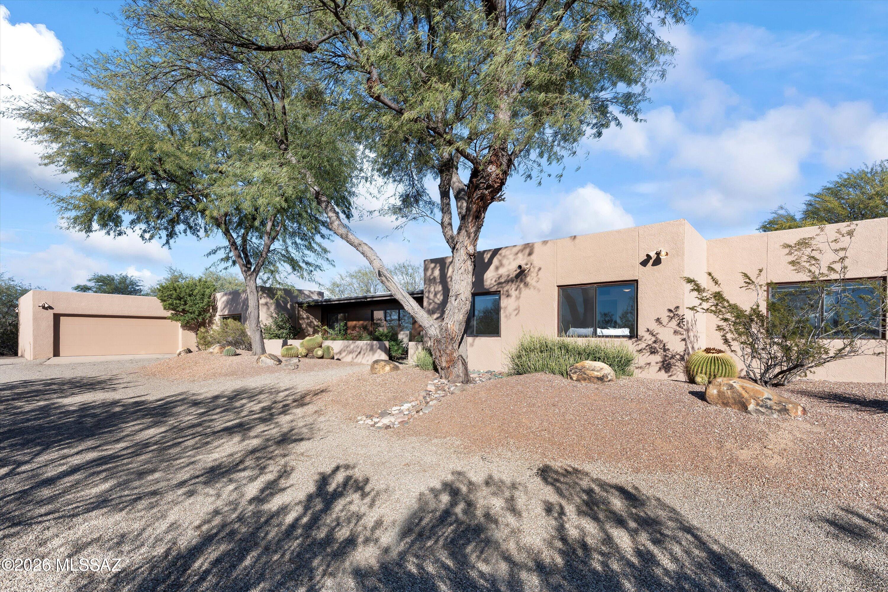 How often do you hear location, location, location? This 5 bdrm, 4 bath home located directly north of Mehl Park at River & Pontatoc is a good reason. Centrally located in the Catalina Foothills with easy access to restaurants, shopping, & schools. Walking distance to Mehl, Brandi Fenton & Smiling Dog Park. Beautiful mountain views, mature trees, natural desert surroundings, and privately set back on the lot. The home offers 3630 sq ft of living space including additional in-law, grad or guest quarters. The extra-large primary suite has two walk-in closets, dual vanity space and a personal patio. Enjoy the sparkling pool, private yard, covered porch, and firepit for entertaining. Additional storage rooms in garage and backyard. Turn your vision into the home of your dreams.