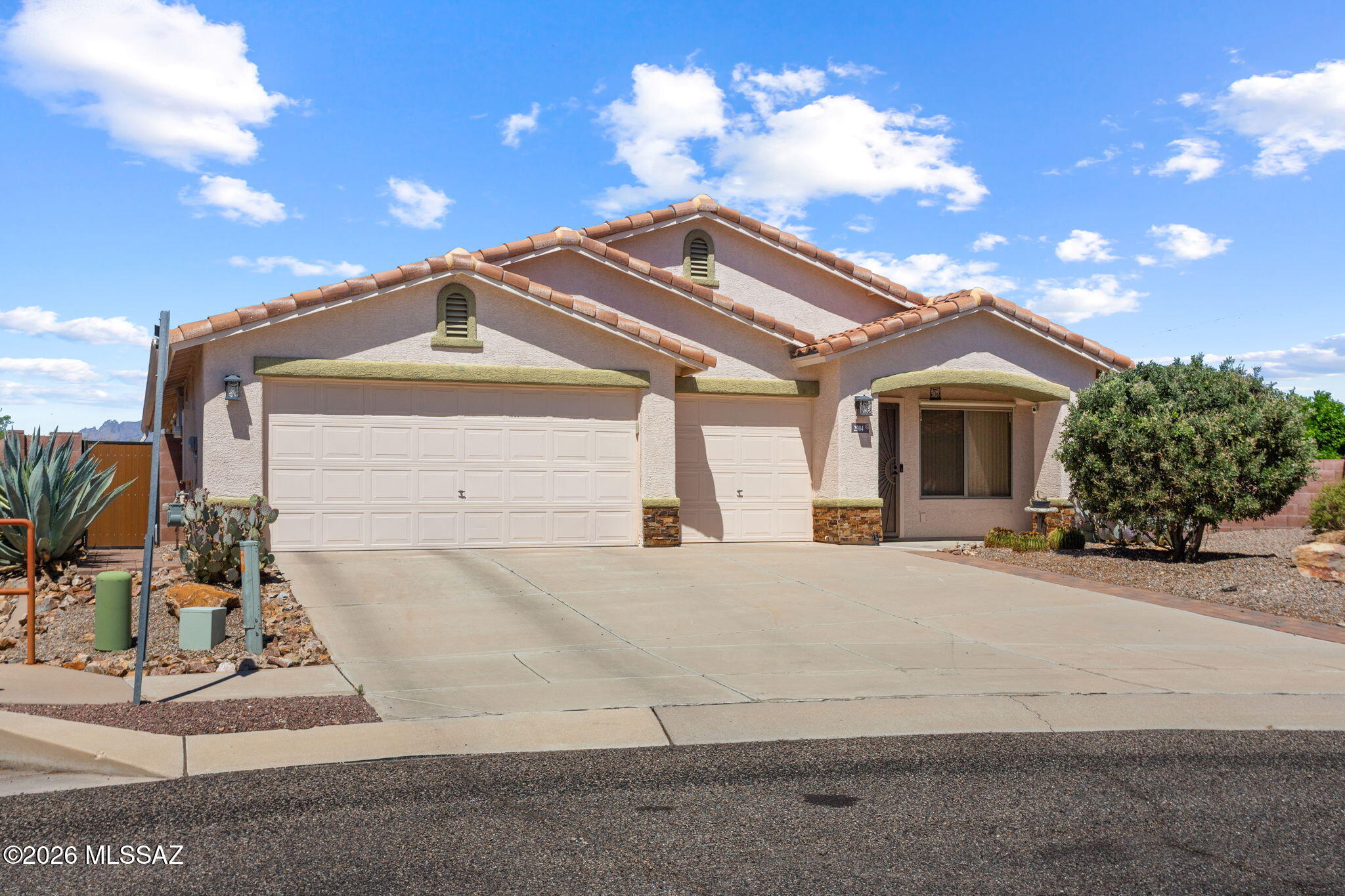 Experience modern Southwest living in this meticulously maintained Tucson home located in the desirable Starr Pass Shadows community. Spanning approximately 1,924 square feet, this residence features soaring vaulted ceilings, abundant natural light, and multiple versatile living and dining areas. The kitchen is well-equipped with granite countertops, a convection oven, pantry, and a reverse osmosis system. The primary suite serves as a spacious sanctuary, complete with a large walk-in closet and an updated  primary bath featuring a large walk in 
 shower! Additional interior comforts include a smart thermostat,  and a water softening system.  Set on an elevated lot adjacent to a scenic wash, the backyard offers privacy and unobstructed mountain vistas. Residents can enjoy a covered patio and a private conventional pool that underwent a professional structural renovation and PebbleTec refresh in early 2025. For peace of mind, the property boasts significant infrastructure upgrades, including a 75-foot main water line replaced with PEX in 2021 that carries a 25-year manufacturer warranty. The home also includes an attached three-car garage and current preventative termite treatment through April 2026 with a transferable warranty. This desert sanctuary is perfectly positioned near world-class golfing and hiking trails while maintaining easy access to downtown attractions.