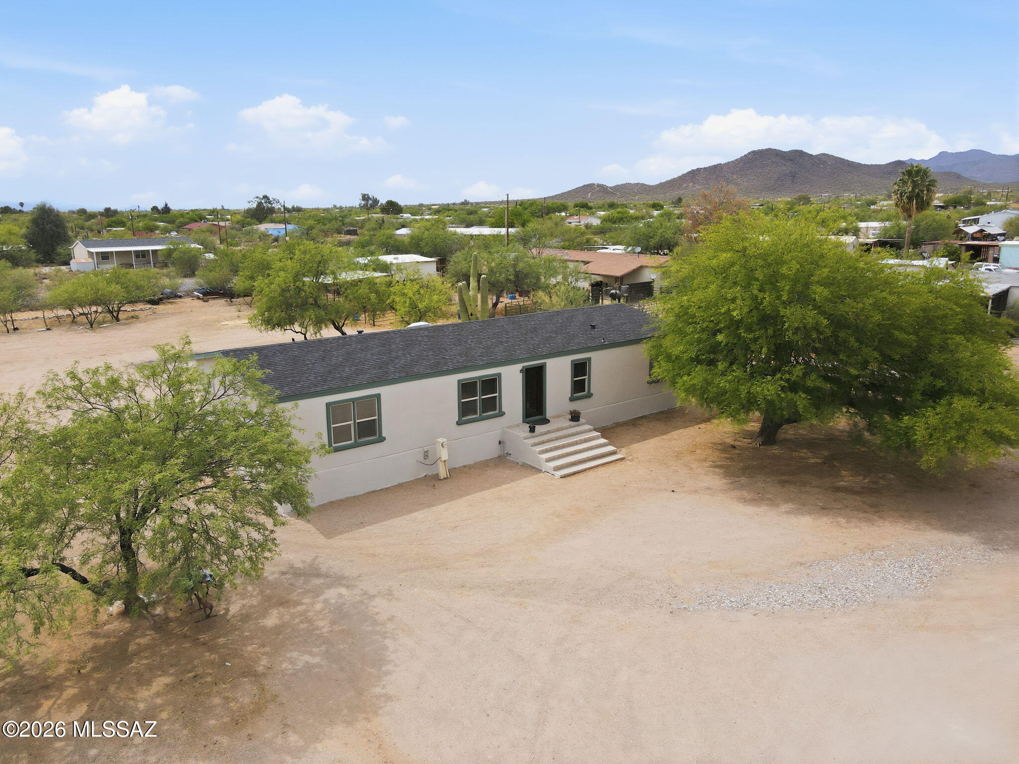 Nestled in the heart of southwest Tucson, this spacious horse property offers the perfect blend of comfort and functionality on an expansive .84-acre lot. Featuring 3 bedrooms and 2.5 baths, the home boasts granite countertops, a welcoming family room, and a separate living area ideal for entertaining or everyday living. Recent upgrades include a brand-new roof and fresh interior and exterior paint, giving the home a clean, updated feel throughout. With plenty of space for horses, toys, or future possibilities, this property delivers the charm of country-style living with the convenience of city access.